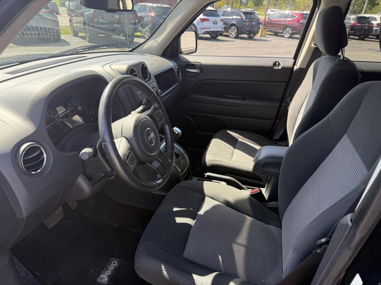 2014 Black /Black Jeep Patriot Latitude 4WD (1C4NJRFB8ED) with an 2.4L I4 DOHC 16V engine, 6 Speed Automatic transmission, located at 11115 Chardon Rd. , Chardon, OH, 44024, (440) 214-9705, 41.580246, -81.241943 - This One Owner 2014 Jeep Patriot Latitude 4WD is the perfect small SUV. Powered by a 2.4 I4 Multiair Engine and a 6 Speed Automatic this Jeep achieves up to 27 MPG Highway while still having Jeep's incredible all weather capability. With heated front seats, remote start and, an auto dimming rearview - Photo#15