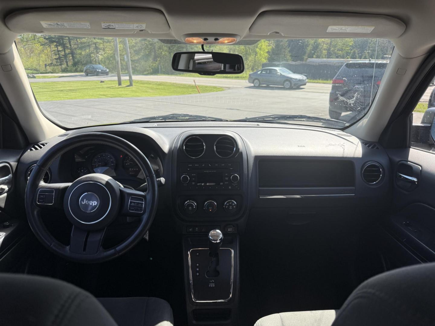 2014 Black /Black Jeep Patriot Latitude 4WD (1C4NJRFB8ED) with an 2.4L I4 DOHC 16V engine, 6 Speed Automatic transmission, located at 11115 Chardon Rd. , Chardon, OH, 44024, (440) 214-9705, 41.580246, -81.241943 - This One Owner 2014 Jeep Patriot Latitude 4WD is the perfect small SUV. Powered by a 2.4 I4 Multiair Engine and a 6 Speed Automatic this Jeep achieves up to 27 MPG Highway while still having Jeep's incredible all weather capability. With heated front seats, remote start and, an auto dimming rearview - Photo#28