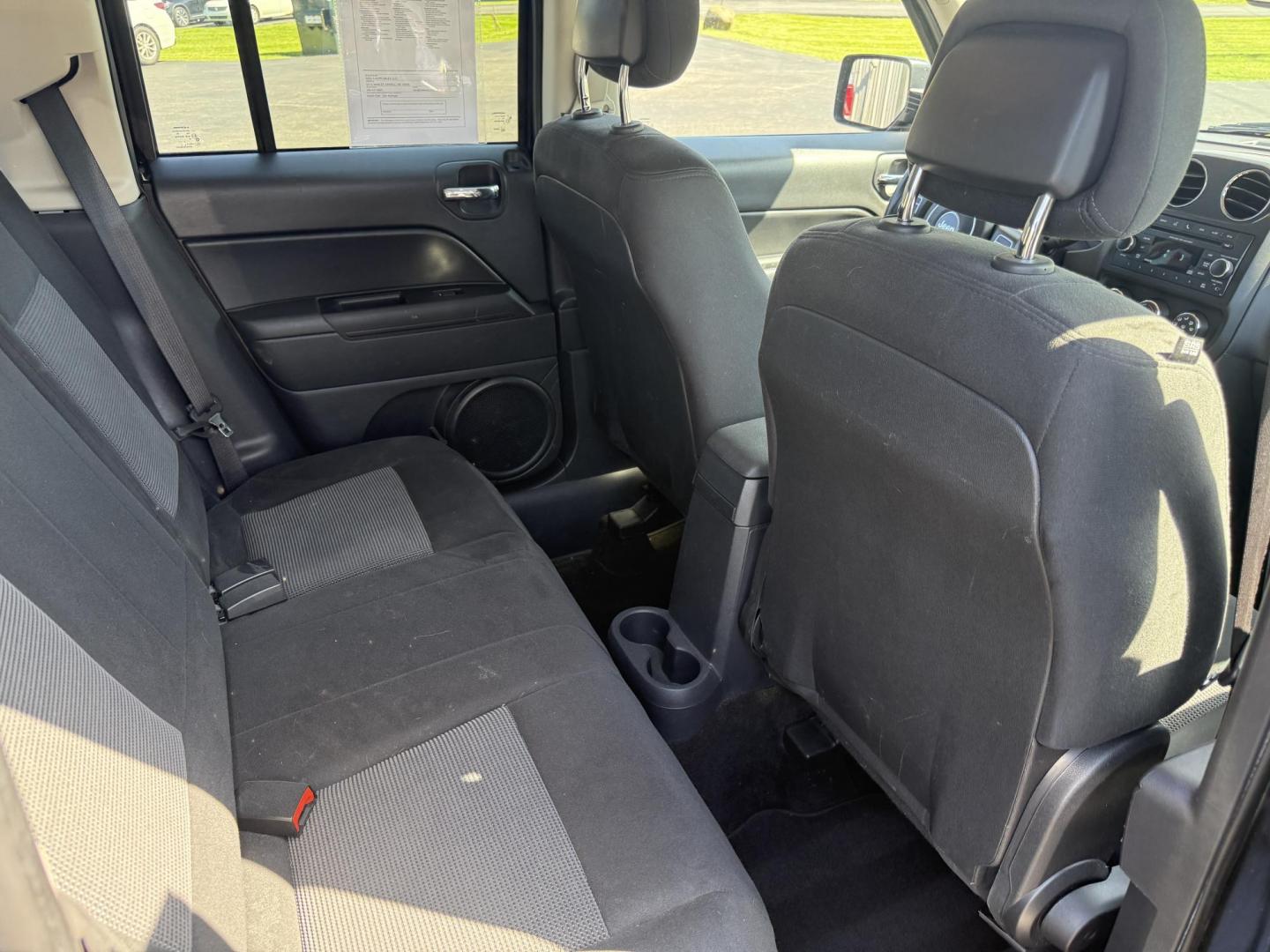 2014 Black /Black Jeep Patriot Latitude 4WD (1C4NJRFB8ED) with an 2.4L I4 DOHC 16V engine, 6 Speed Automatic transmission, located at 11115 Chardon Rd. , Chardon, OH, 44024, (440) 214-9705, 41.580246, -81.241943 - This One Owner 2014 Jeep Patriot Latitude 4WD is the perfect small SUV. Powered by a 2.4 I4 Multiair Engine and a 6 Speed Automatic this Jeep achieves up to 27 MPG Highway while still having Jeep's incredible all weather capability. With heated front seats, remote start and, an auto dimming rearview - Photo#31