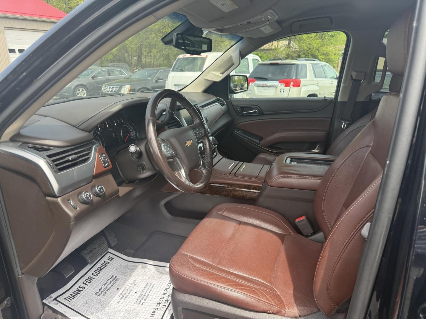 2018 Black /Brown Chevrolet Tahoe Premier 4WD (1GNSKCKC4JR) with an 5.3L V8 OHV 16V engine, 6A transmission, located at 547 E. Main St., Orwell, OH, 44076, (440) 437-5893, 41.535435, -80.847855 - This 2018 Chevrolet Tahoe Premier 4WD with a 5.3L EcoTec3 V8 engine offers robust power and impressive towing capacity of 8,200 pounds, making it ideal for hauling and family adventures. It features a luxurious leather interior with heated and cooled front seats, heated second-row captain’s chairs - Photo#4
