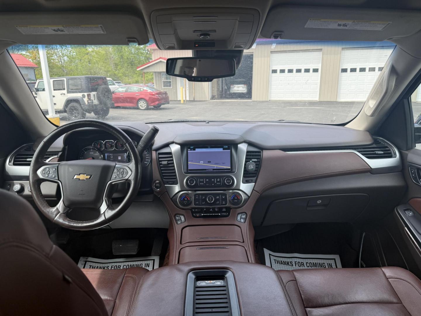 2018 Black /Brown Chevrolet Tahoe Premier 4WD (1GNSKCKC4JR) with an 5.3L V8 OHV 16V engine, 6A transmission, located at 547 E. Main St., Orwell, OH, 44076, (440) 437-5893, 41.535435, -80.847855 - This 2018 Chevrolet Tahoe Premier 4WD with a 5.3L EcoTec3 V8 engine offers robust power and impressive towing capacity of 8,200 pounds, making it ideal for hauling and family adventures. It features a luxurious leather interior with heated and cooled front seats, heated second-row captain’s chairs - Photo#31