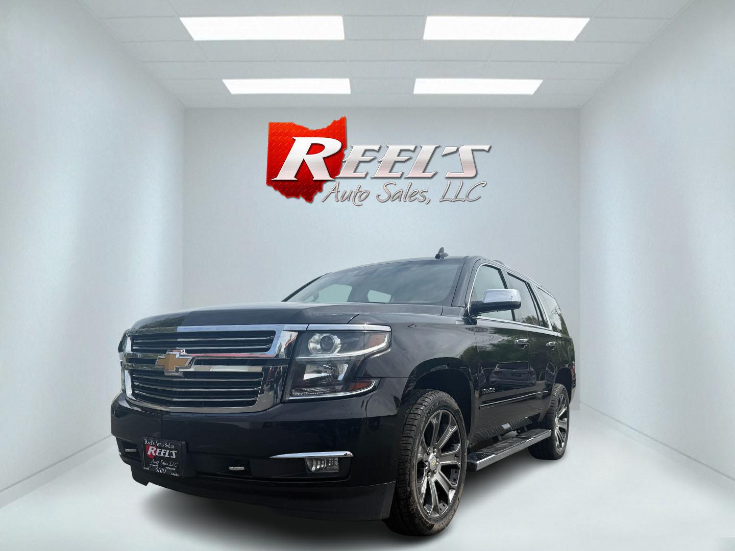 2018 Black /Brown Chevrolet Tahoe Premier 4WD (1GNSKCKC4JR) with an 5.3L V8 OHV 16V engine, 6A transmission, located at 547 E. Main St., Orwell, OH, 44076, (440) 437-5893, 41.535435, -80.847855 - This 2018 Chevrolet Tahoe Premier 4WD with a 5.3L EcoTec3 V8 engine offers robust power and impressive towing capacity of 8,200 pounds, making it ideal for hauling and family adventures. It features a luxurious leather interior with heated and cooled front seats, heated second-row captain’s chairs - Photo#0