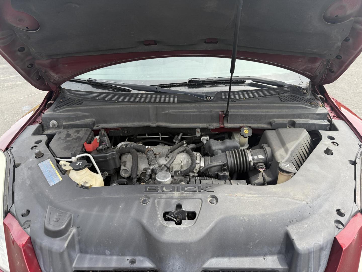 2010 Red /Black Buick Enclave CXL AWD (5GALVBED2AJ) with an 3.6L V6 DOHC 24V engine, 6-Speed Automatic Overdrive transmission, located at 547 E. Main St., Orwell, OH, 44076, (440) 437-5893, 41.535435, -80.847855 - This 2010 Buick Enclave is a true transportation special. With a leather interior, heated front seats, backup camera and a power drivers seat you will be comfortable in North East Ohio's winter months. Come take a look before it's gone. This vehicle is AS IS. - Photo#3