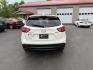 2014 White /Black Mazda CX-5 Touring AWD (JM3KE4CY7E0) with an 2.5L I4 DOHC 16V engine, 6-Speed Automatic transmission, located at 547 E. Main St., Orwell, OH, 44076, (440) 437-5893, 41.535435, -80.847855 - This 2014 Mazda CX-5 Touring features a 2.5L inline-4 engine paired with a 6-speed automatic transmission, offering a balanced blend of performance and efficiency with an estimated 29 MPG on the highway. It comes well-equipped for its class, including a 6.5-inch touchscreen, backup camera, blind spo - Photo#8