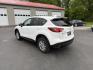 2014 White /Black Mazda CX-5 Touring AWD (JM3KE4CY7E0) with an 2.5L I4 DOHC 16V engine, 6-Speed Automatic transmission, located at 547 E. Main St., Orwell, OH, 44076, (440) 437-5893, 41.535435, -80.847855 - This 2014 Mazda CX-5 Touring features a 2.5L inline-4 engine paired with a 6-speed automatic transmission, offering a balanced blend of performance and efficiency with an estimated 29 MPG on the highway. It comes well-equipped for its class, including a 6.5-inch touchscreen, backup camera, blind spo - Photo#9