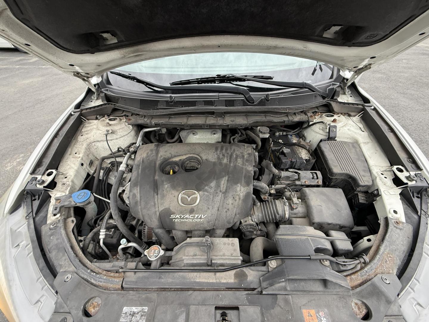 2014 White /Black Mazda CX-5 Touring AWD (JM3KE4CY7E0) with an 2.5L I4 DOHC 16V engine, 6-Speed Automatic transmission, located at 547 E. Main St., Orwell, OH, 44076, (440) 437-5893, 41.535435, -80.847855 - This 2014 Mazda CX-5 Touring features a 2.5L inline-4 engine paired with a 6-speed automatic transmission, offering a balanced blend of performance and efficiency with an estimated 29 MPG on the highway. It comes well-equipped for its class, including a 6.5-inch touchscreen, backup camera, blind spo - Photo#14