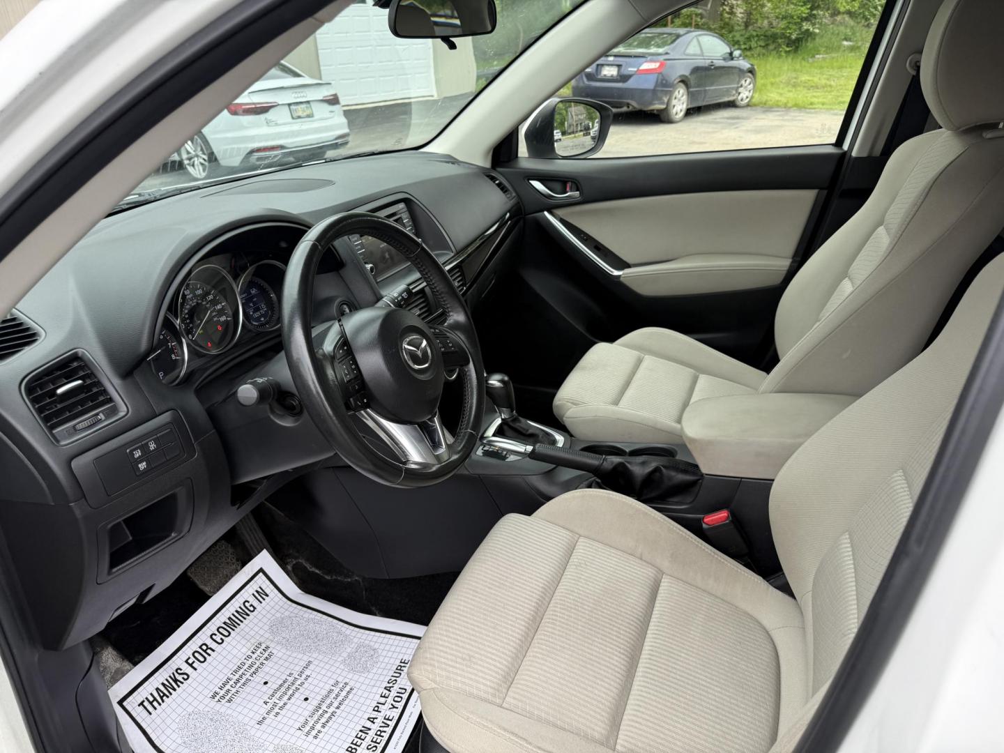 2014 White /Black Mazda CX-5 Touring AWD (JM3KE4CY7E0) with an 2.5L I4 DOHC 16V engine, 6-Speed Automatic transmission, located at 547 E. Main St., Orwell, OH, 44076, (440) 437-5893, 41.535435, -80.847855 - This 2014 Mazda CX-5 Touring features a 2.5L inline-4 engine paired with a 6-speed automatic transmission, offering a balanced blend of performance and efficiency with an estimated 29 MPG on the highway. It comes well-equipped for its class, including a 6.5-inch touchscreen, backup camera, blind spo - Photo#15