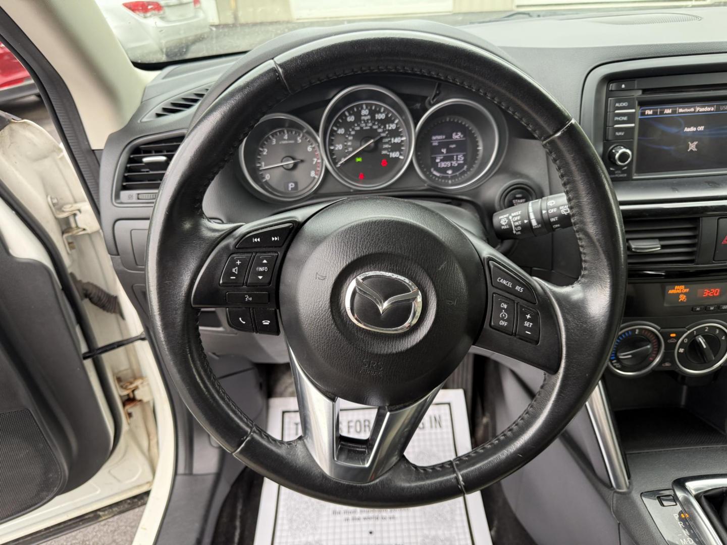 2014 White /Black Mazda CX-5 Touring AWD (JM3KE4CY7E0) with an 2.5L I4 DOHC 16V engine, 6-Speed Automatic transmission, located at 547 E. Main St., Orwell, OH, 44076, (440) 437-5893, 41.535435, -80.847855 - This 2014 Mazda CX-5 Touring features a 2.5L inline-4 engine paired with a 6-speed automatic transmission, offering a balanced blend of performance and efficiency with an estimated 29 MPG on the highway. It comes well-equipped for its class, including a 6.5-inch touchscreen, backup camera, blind spo - Photo#22