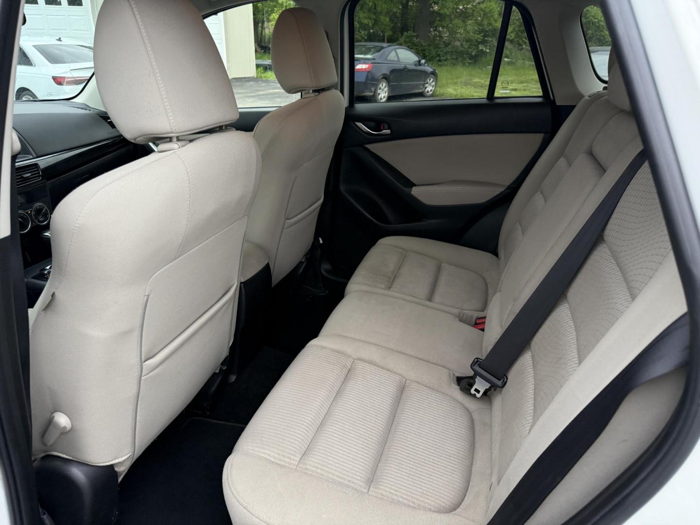 2014 White /Black Mazda CX-5 Touring AWD (JM3KE4CY7E0) with an 2.5L I4 DOHC 16V engine, 6-Speed Automatic transmission, located at 547 E. Main St., Orwell, OH, 44076, (440) 437-5893, 41.535435, -80.847855 - This 2014 Mazda CX-5 Touring features a 2.5L inline-4 engine paired with a 6-speed automatic transmission, offering a balanced blend of performance and efficiency with an estimated 29 MPG on the highway. It comes well-equipped for its class, including a 6.5-inch touchscreen, backup camera, blind spo - Photo#28