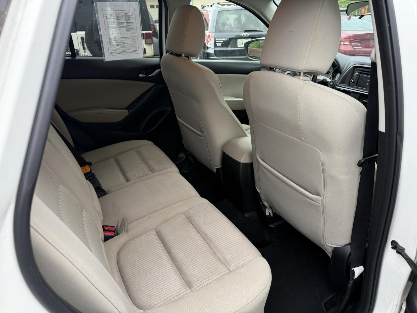 2014 White /Black Mazda CX-5 Touring AWD (JM3KE4CY7E0) with an 2.5L I4 DOHC 16V engine, 6-Speed Automatic transmission, located at 547 E. Main St., Orwell, OH, 44076, (440) 437-5893, 41.535435, -80.847855 - This 2014 Mazda CX-5 Touring features a 2.5L inline-4 engine paired with a 6-speed automatic transmission, offering a balanced blend of performance and efficiency with an estimated 29 MPG on the highway. It comes well-equipped for its class, including a 6.5-inch touchscreen, backup camera, blind spo - Photo#33