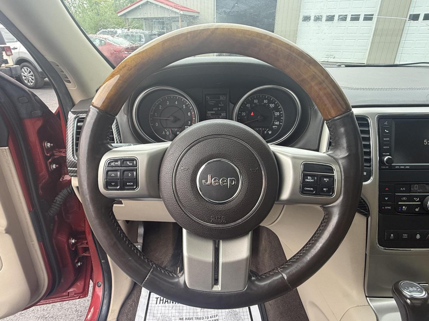 2011 Red /Tan Jeep Grand Cherokee Overland 4WD (1J4RR6GT8BC) with an 5.7L V8 OHV 16V engine, 5-Speed Automatic transmission, located at 547 E. Main St., Orwell, OH, 44076, (440) 437-5893, 41.535435, -80.847855 - This 2011 Jeep Grand Cherokee Overland 4WD comes equipped with a powerful 5.7L HEMI V8 engine and a 5-speed automatic transmission, offering robust performance and a substantial 7,200-pound towing capacity. Its luxury-oriented interior features leather seating, heated and cooled front seats, a 6.5-i - Photo#19