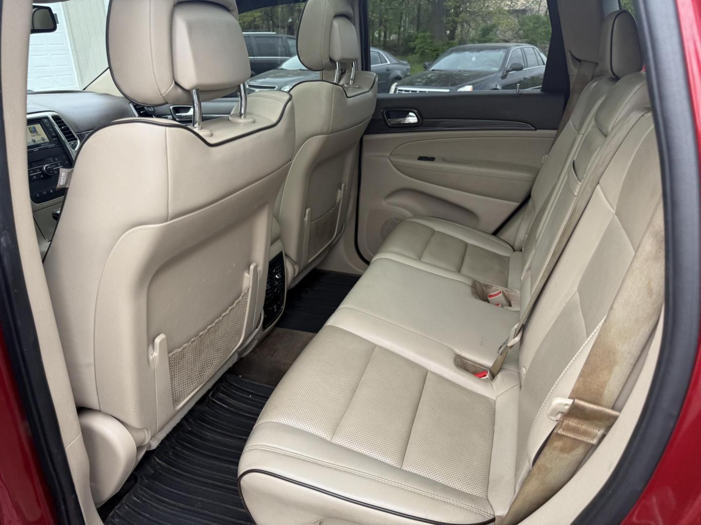 2011 Red /Tan Jeep Grand Cherokee Overland 4WD (1J4RR6GT8BC) with an 5.7L V8 OHV 16V engine, 5-Speed Automatic transmission, located at 547 E. Main St., Orwell, OH, 44076, (440) 437-5893, 41.535435, -80.847855 - This 2011 Jeep Grand Cherokee Overland 4WD comes equipped with a powerful 5.7L HEMI V8 engine and a 5-speed automatic transmission, offering robust performance and a substantial 7,200-pound towing capacity. Its luxury-oriented interior features leather seating, heated and cooled front seats, a 6.5-i - Photo#27