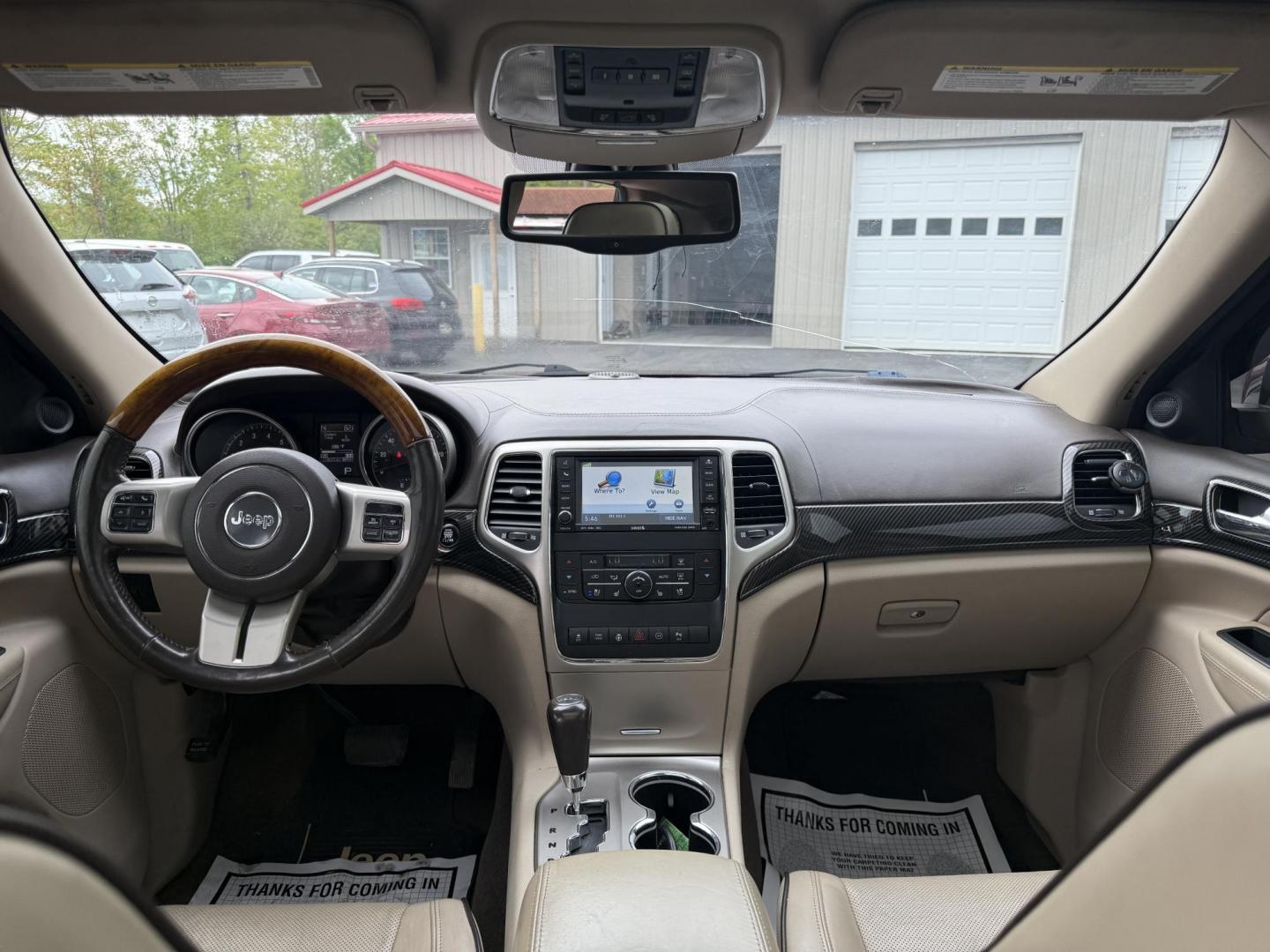 2011 Red /Tan Jeep Grand Cherokee Overland 4WD (1J4RR6GT8BC) with an 5.7L V8 OHV 16V engine, 5-Speed Automatic transmission, located at 547 E. Main St., Orwell, OH, 44076, (440) 437-5893, 41.535435, -80.847855 - This 2011 Jeep Grand Cherokee Overland 4WD comes equipped with a powerful 5.7L HEMI V8 engine and a 5-speed automatic transmission, offering robust performance and a substantial 7,200-pound towing capacity. Its luxury-oriented interior features leather seating, heated and cooled front seats, a 6.5-i - Photo#30