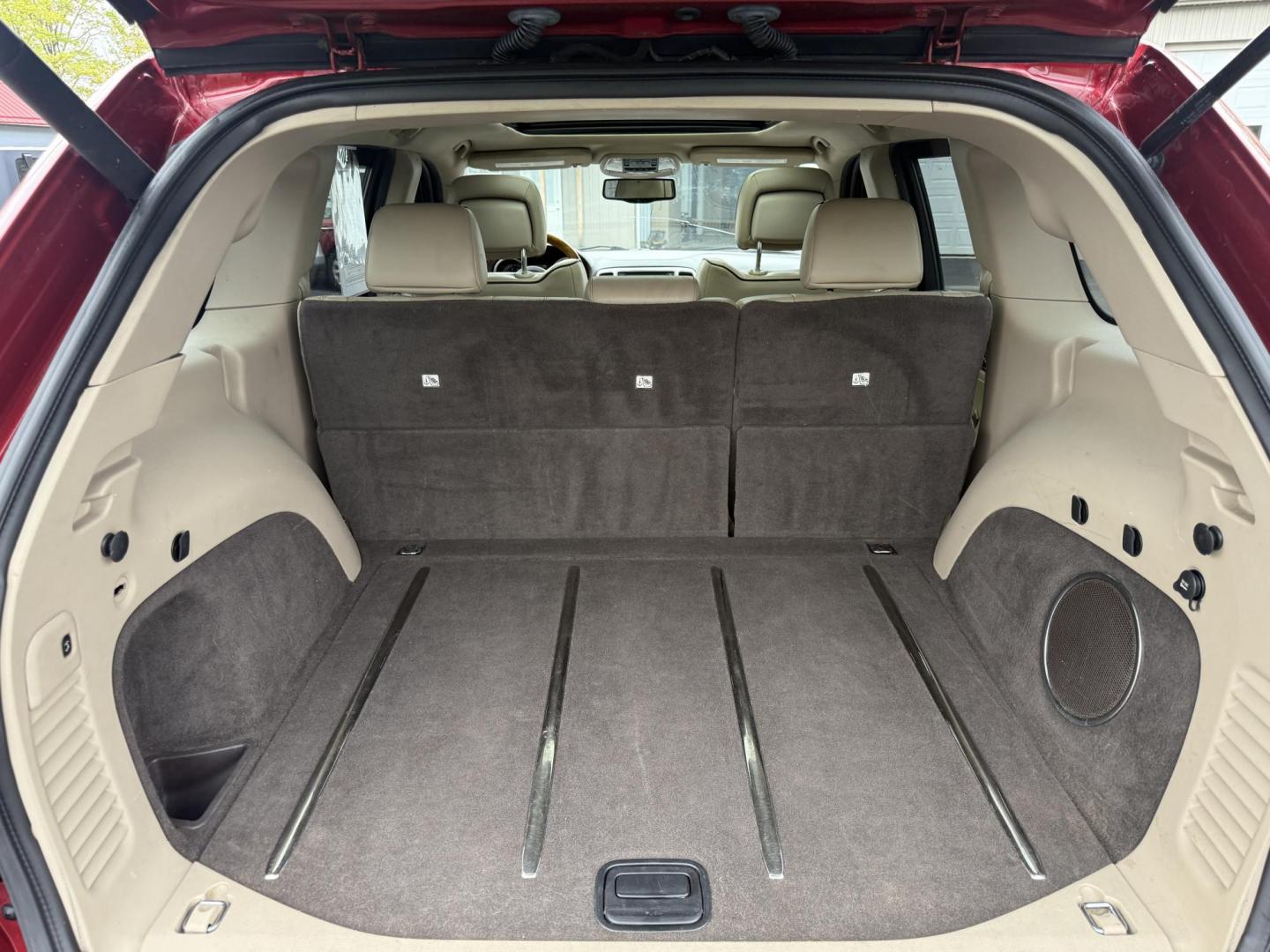 2011 Red /Tan Jeep Grand Cherokee Overland 4WD (1J4RR6GT8BC) with an 5.7L V8 OHV 16V engine, 5-Speed Automatic transmission, located at 547 E. Main St., Orwell, OH, 44076, (440) 437-5893, 41.535435, -80.847855 - This 2011 Jeep Grand Cherokee Overland 4WD comes equipped with a powerful 5.7L HEMI V8 engine and a 5-speed automatic transmission, offering robust performance and a substantial 7,200-pound towing capacity. Its luxury-oriented interior features leather seating, heated and cooled front seats, a 6.5-i - Photo#31