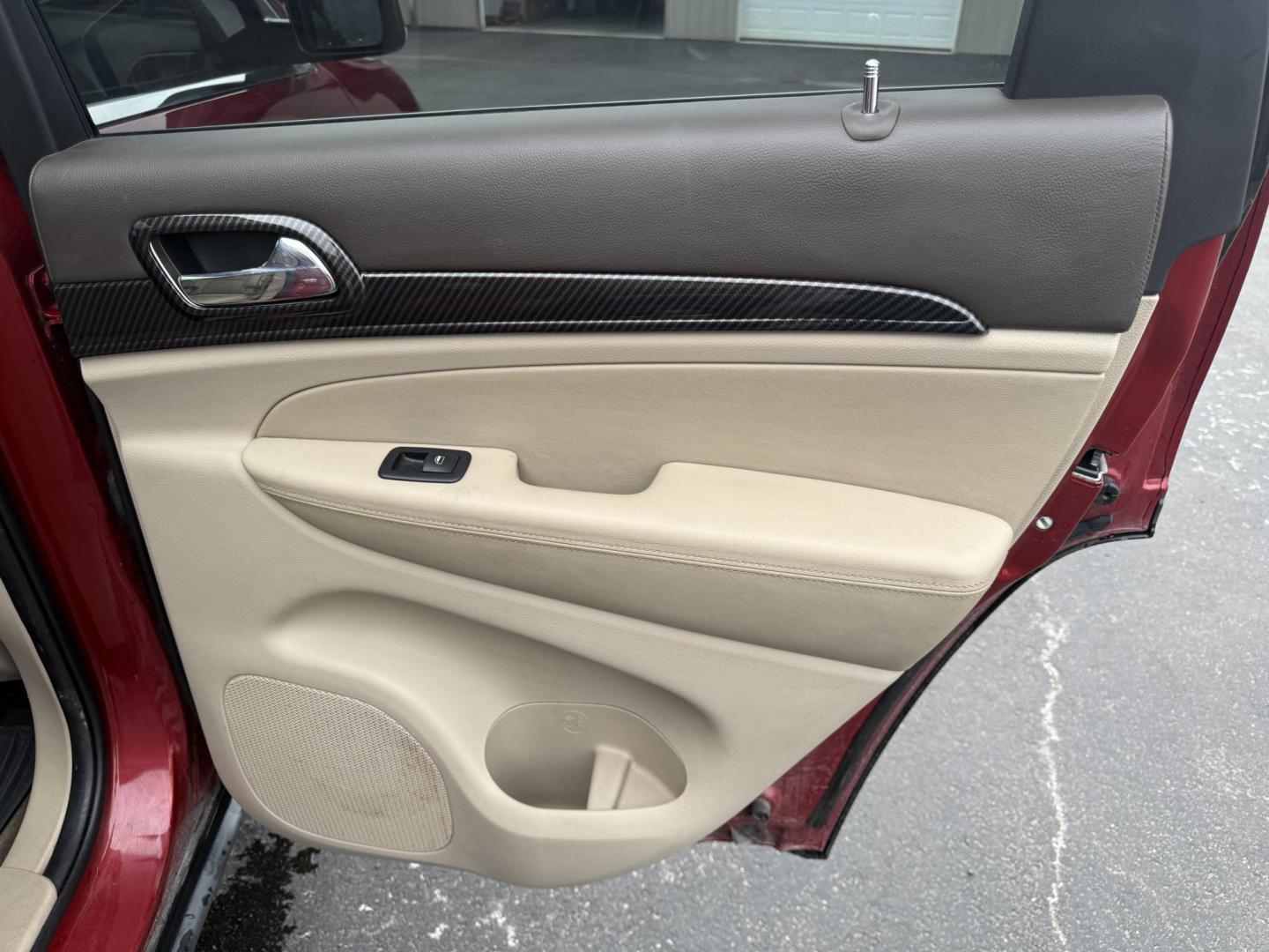 2011 Red /Tan Jeep Grand Cherokee Overland 4WD (1J4RR6GT8BC) with an 5.7L V8 OHV 16V engine, 5-Speed Automatic transmission, located at 547 E. Main St., Orwell, OH, 44076, (440) 437-5893, 41.535435, -80.847855 - This 2011 Jeep Grand Cherokee Overland 4WD comes equipped with a powerful 5.7L HEMI V8 engine and a 5-speed automatic transmission, offering robust performance and a substantial 7,200-pound towing capacity. Its luxury-oriented interior features leather seating, heated and cooled front seats, a 6.5-i - Photo#35
