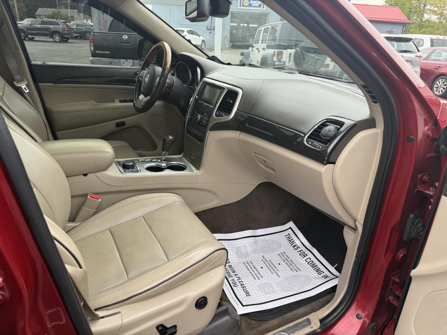 2011 Red /Tan Jeep Grand Cherokee Overland 4WD (1J4RR6GT8BC) with an 5.7L V8 OHV 16V engine, 5-Speed Automatic transmission, located at 547 E. Main St., Orwell, OH, 44076, (440) 437-5893, 41.535435, -80.847855 - This 2011 Jeep Grand Cherokee Overland 4WD comes equipped with a powerful 5.7L HEMI V8 engine and a 5-speed automatic transmission, offering robust performance and a substantial 7,200-pound towing capacity. Its luxury-oriented interior features leather seating, heated and cooled front seats, a 6.5-i - Photo#36