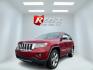 2011 Red /Tan Jeep Grand Cherokee Overland 4WD (1J4RR6GT8BC) with an 5.7L V8 OHV 16V engine, 5-Speed Automatic transmission, located at 547 E. Main St., Orwell, OH, 44076, (440) 437-5893, 41.535435, -80.847855 - This 2011 Jeep Grand Cherokee Overland 4WD comes equipped with a powerful 5.7L HEMI V8 engine and a 5-speed automatic transmission, offering robust performance and a substantial 7,200-pound towing capacity. Its luxury-oriented interior features leather seating, heated and cooled front seats, a 6.5-i - Photo#0