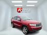 2011 Red /Tan Jeep Grand Cherokee Overland 4WD (1J4RR6GT8BC) with an 5.7L V8 OHV 16V engine, 5-Speed Automatic transmission, located at 547 E. Main St., Orwell, OH, 44076, (440) 437-5893, 41.535435, -80.847855 - This 2011 Jeep Grand Cherokee Overland 4WD comes equipped with a powerful 5.7L HEMI V8 engine and a 5-speed automatic transmission, offering robust performance and a substantial 7,200-pound towing capacity. Its luxury-oriented interior features leather seating, heated and cooled front seats, a 6.5-i - Photo#2