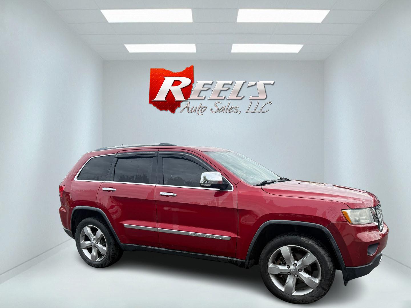 2011 Red /Tan Jeep Grand Cherokee Overland 4WD (1J4RR6GT8BC) with an 5.7L V8 OHV 16V engine, 5-Speed Automatic transmission, located at 547 E. Main St., Orwell, OH, 44076, (440) 437-5893, 41.535435, -80.847855 - This 2011 Jeep Grand Cherokee Overland 4WD comes equipped with a powerful 5.7L HEMI V8 engine and a 5-speed automatic transmission, offering robust performance and a substantial 7,200-pound towing capacity. Its luxury-oriented interior features leather seating, heated and cooled front seats, a 6.5-i - Photo#11