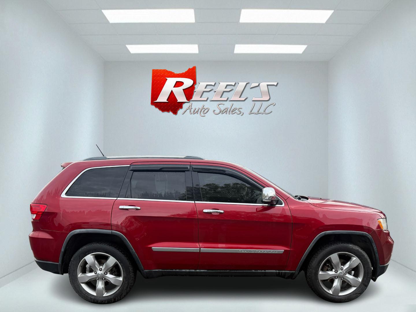 2011 Red /Tan Jeep Grand Cherokee Overland 4WD (1J4RR6GT8BC) with an 5.7L V8 OHV 16V engine, 5-Speed Automatic transmission, located at 547 E. Main St., Orwell, OH, 44076, (440) 437-5893, 41.535435, -80.847855 - This 2011 Jeep Grand Cherokee Overland 4WD comes equipped with a powerful 5.7L HEMI V8 engine and a 5-speed automatic transmission, offering robust performance and a substantial 7,200-pound towing capacity. Its luxury-oriented interior features leather seating, heated and cooled front seats, a 6.5-i - Photo#12