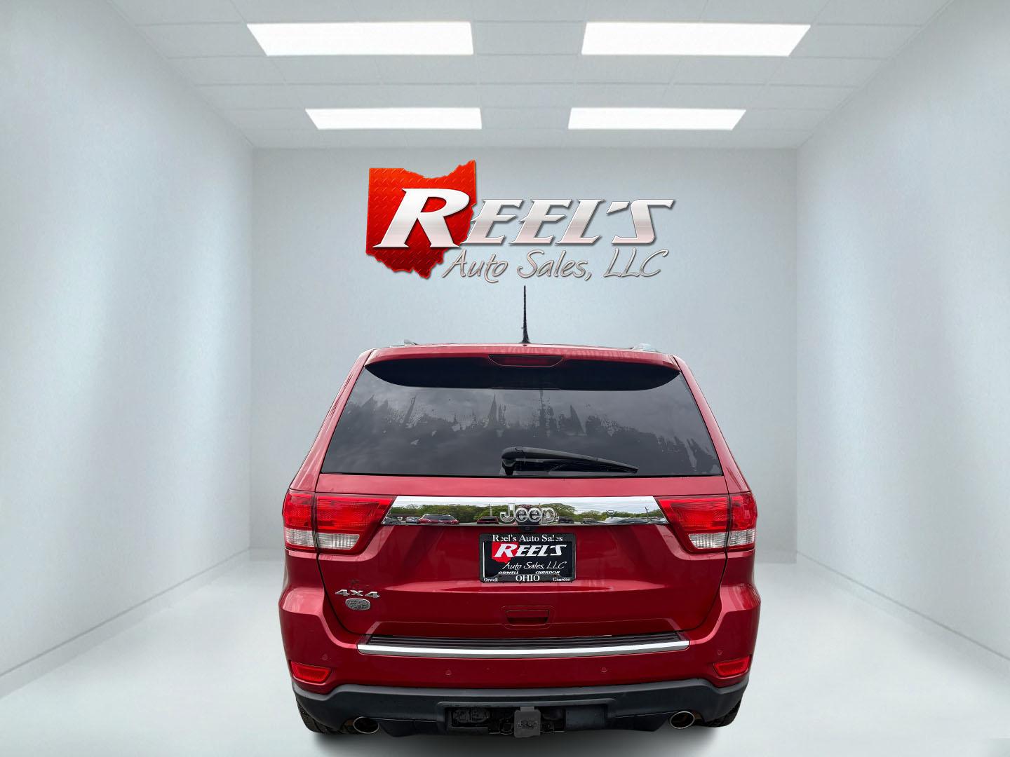 2011 Red /Tan Jeep Grand Cherokee Overland 4WD (1J4RR6GT8BC) with an 5.7L V8 OHV 16V engine, 5-Speed Automatic transmission, located at 547 E. Main St., Orwell, OH, 44076, (440) 437-5893, 41.535435, -80.847855 - This 2011 Jeep Grand Cherokee Overland 4WD comes equipped with a powerful 5.7L HEMI V8 engine and a 5-speed automatic transmission, offering robust performance and a substantial 7,200-pound towing capacity. Its luxury-oriented interior features leather seating, heated and cooled front seats, a 6.5-i - Photo#40