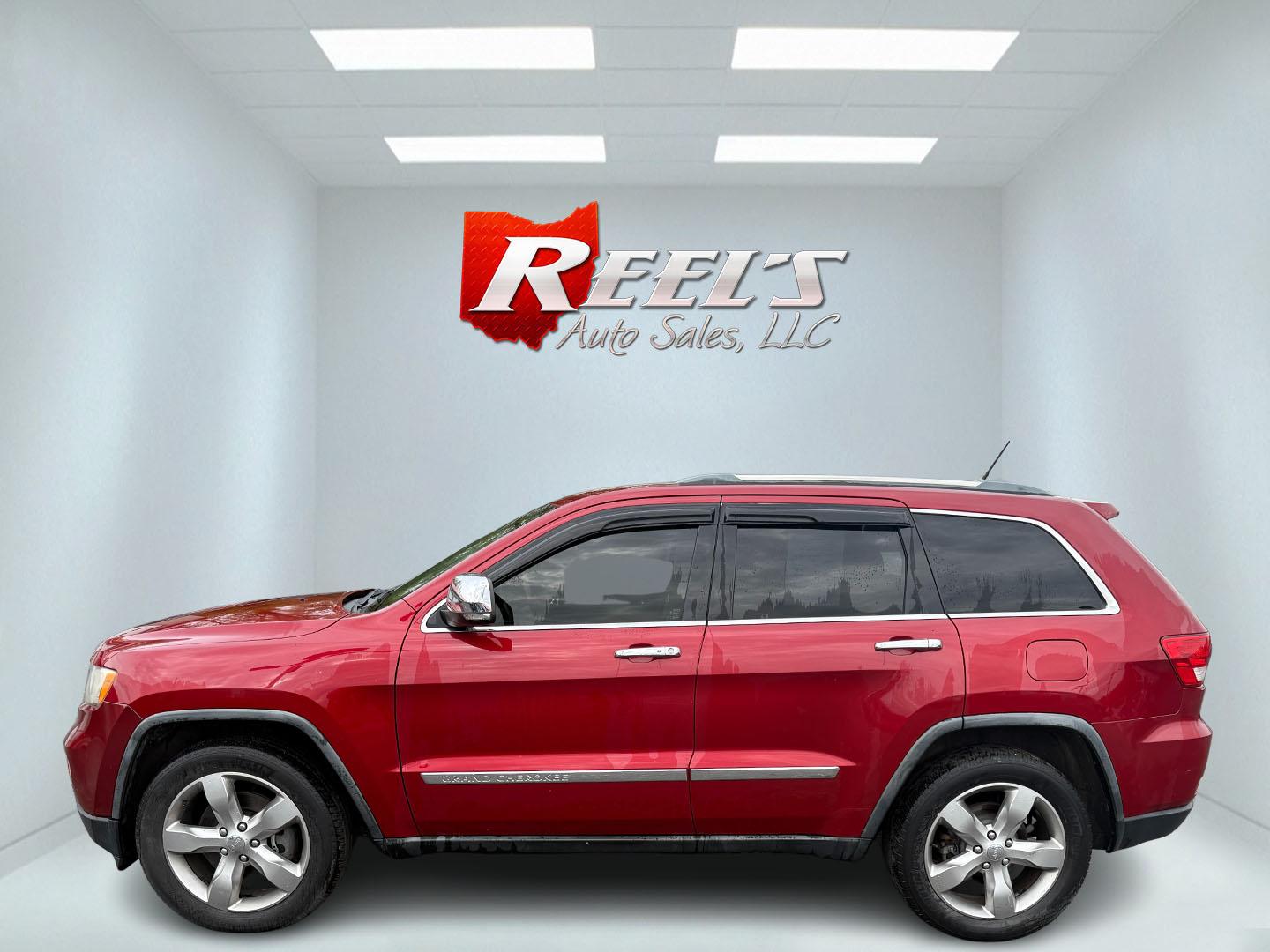 2011 Red /Tan Jeep Grand Cherokee Overland 4WD (1J4RR6GT8BC) with an 5.7L V8 OHV 16V engine, 5-Speed Automatic transmission, located at 547 E. Main St., Orwell, OH, 44076, (440) 437-5893, 41.535435, -80.847855 - This 2011 Jeep Grand Cherokee Overland 4WD comes equipped with a powerful 5.7L HEMI V8 engine and a 5-speed automatic transmission, offering robust performance and a substantial 7,200-pound towing capacity. Its luxury-oriented interior features leather seating, heated and cooled front seats, a 6.5-i - Photo#43