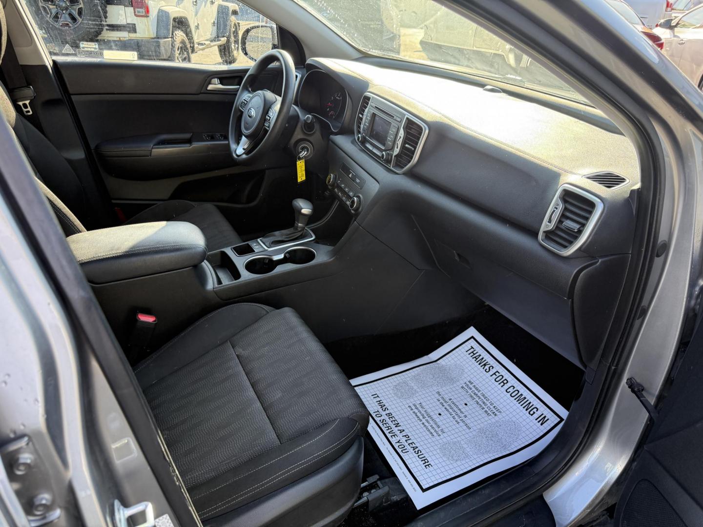 2019 Silver /Black Kia Sportage LX FWD (KNDPM3AC9K7) with an 2.4L I4 DOHC 16V engine, 6A transmission, located at 547 E. Main St., Orwell, OH, 44076, (440) 437-5893, 41.535435, -80.847855 - FRESH TRADE ALERT ---- This 2019 Kia Sportage LX FWD features a 2.4L I4 GDI engine paired with a 6-speed automatic transmission, offering an EPA-estimated 30 MPG on the highway. Notable features include LED daytime running lights, dusk-sensing headlights, a backup camera, and a 5.0" touchscreen info - Photo#31