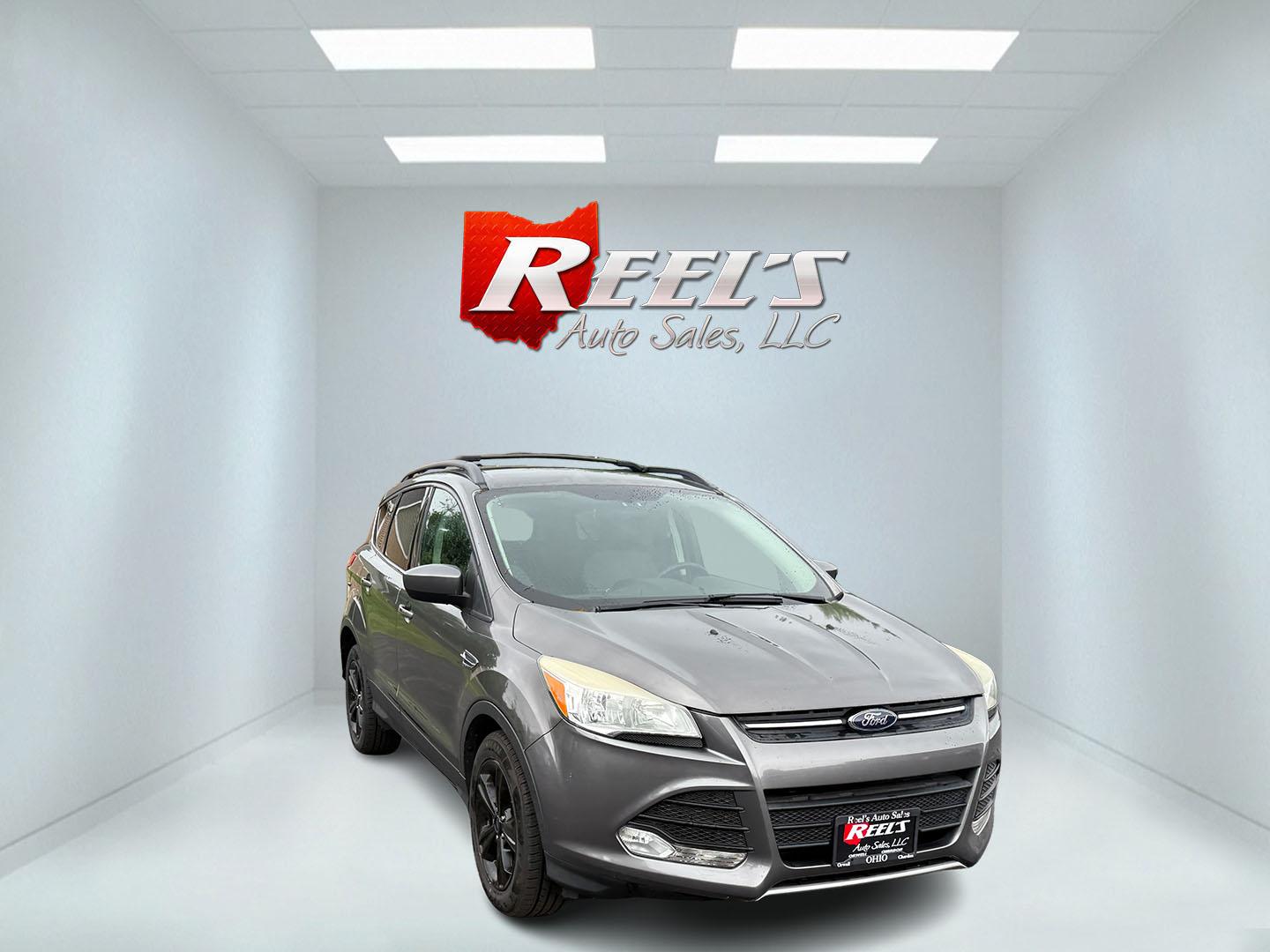 2014 Gray /Black Ford Escape SE 4WD (1FMCU9GX8EU) with an 1.6L I4 DOHC 16V TURBO engine, 6-Speed Automatic transmission, located at 11115 Chardon Rd. , Chardon, OH, 44024, (440) 214-9705, 41.580246, -81.241943 - Photo#2