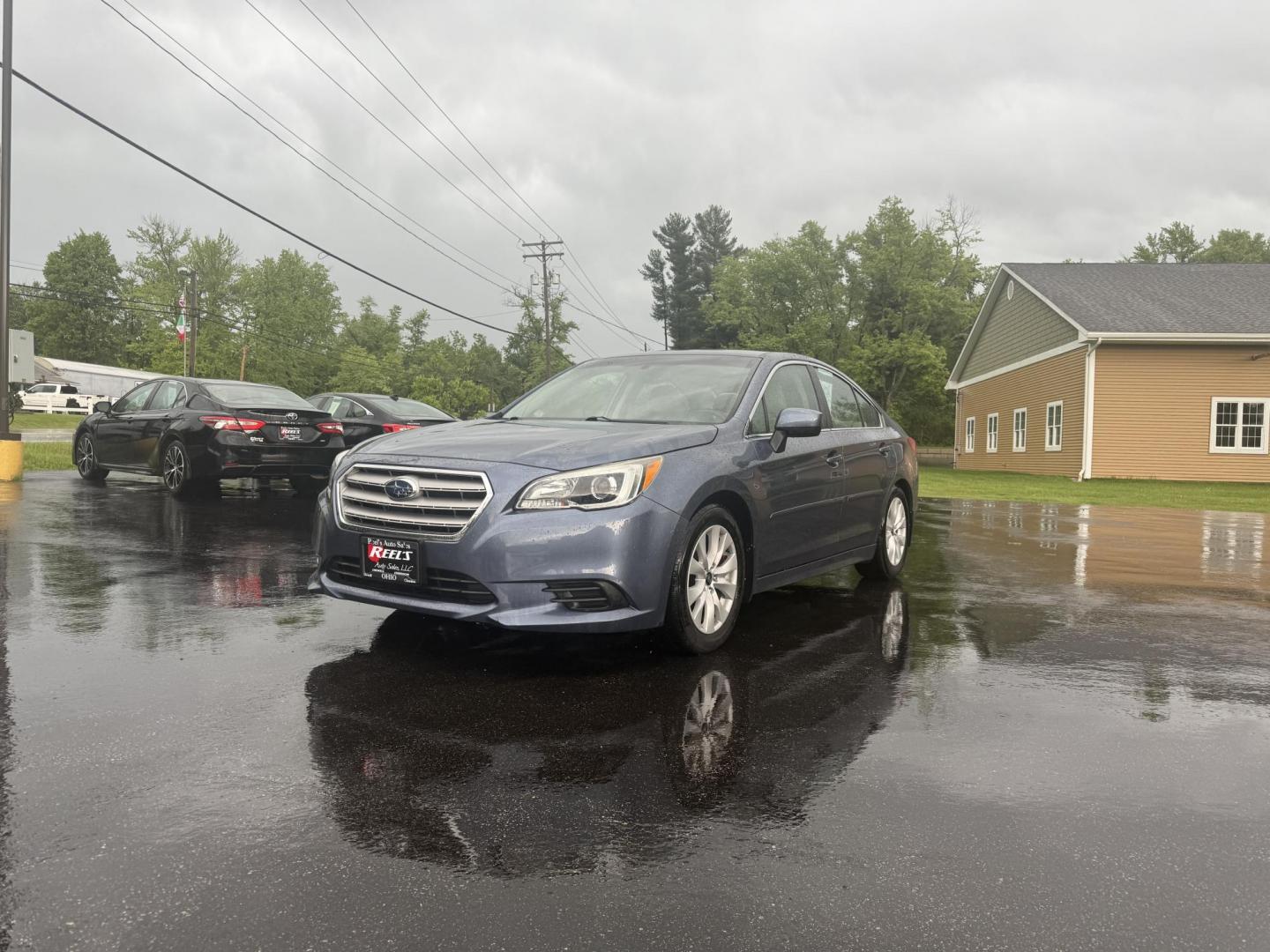 2015 Blue /Tan Subaru Legacy 2.5i Premium (4S3BNAC69F3) with an 2.5L H4 DOHC 16V engine, Automatic transmission, located at 11115 Chardon Rd. , Chardon, OH, 44024, (440) 214-9705, 41.580246, -81.241943 - This 2015 Subaru Legacy 2.5i Premium is equipped with a 2.5L H4 engine and Subaru's renowned Symmetrical All-Wheel Drive, delivering excellent traction and up to 35 MPG highway. This midsize sedan offers comfort and convenience with dual-zone automatic climate control, heated front seats, a power dr - Photo#0
