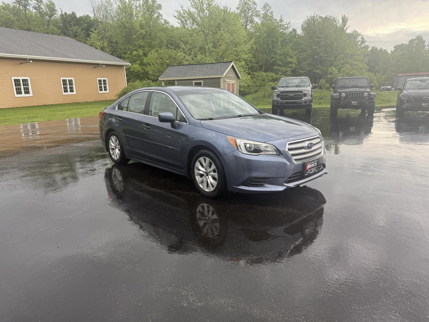 2015 Blue /Tan Subaru Legacy 2.5i Premium (4S3BNAC69F3) with an 2.5L H4 DOHC 16V engine, Automatic transmission, located at 11115 Chardon Rd. , Chardon, OH, 44024, (440) 214-9705, 41.580246, -81.241943 - This 2015 Subaru Legacy 2.5i Premium is equipped with a 2.5L H4 engine and Subaru's renowned Symmetrical All-Wheel Drive, delivering excellent traction and up to 35 MPG highway. This midsize sedan offers comfort and convenience with dual-zone automatic climate control, heated front seats, a power dr - Photo#2