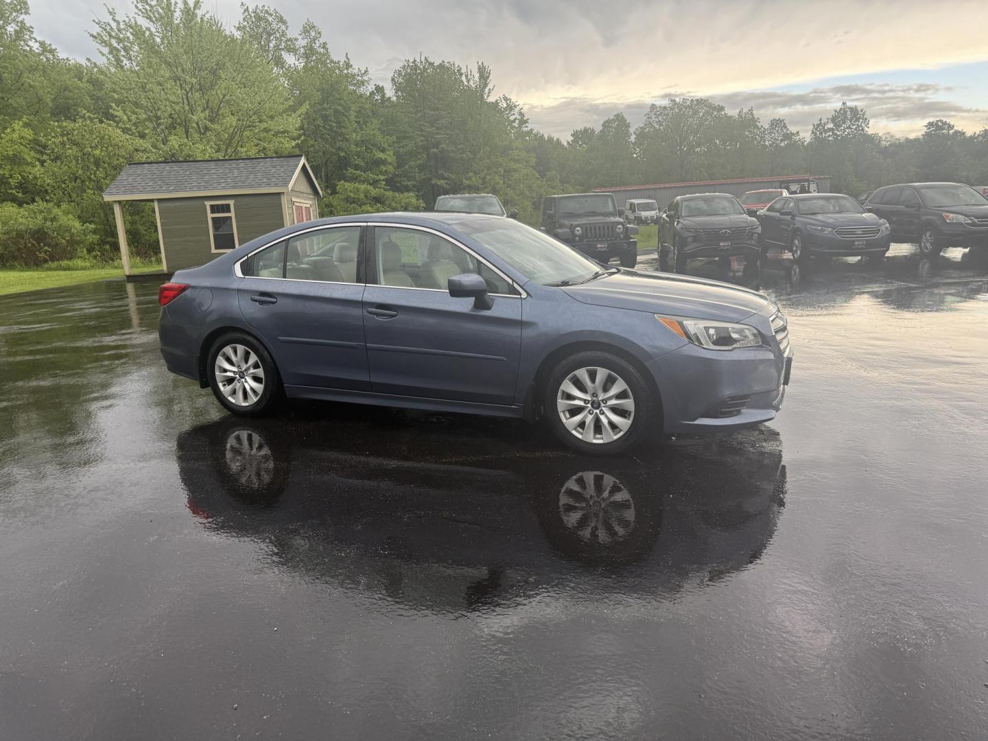 2015 Blue /Tan Subaru Legacy 2.5i Premium (4S3BNAC69F3) with an 2.5L H4 DOHC 16V engine, Automatic transmission, located at 11115 Chardon Rd. , Chardon, OH, 44024, (440) 214-9705, 41.580246, -81.241943 - This 2015 Subaru Legacy 2.5i Premium is equipped with a 2.5L H4 engine and Subaru's renowned Symmetrical All-Wheel Drive, delivering excellent traction and up to 35 MPG highway. This midsize sedan offers comfort and convenience with dual-zone automatic climate control, heated front seats, a power dr - Photo#3