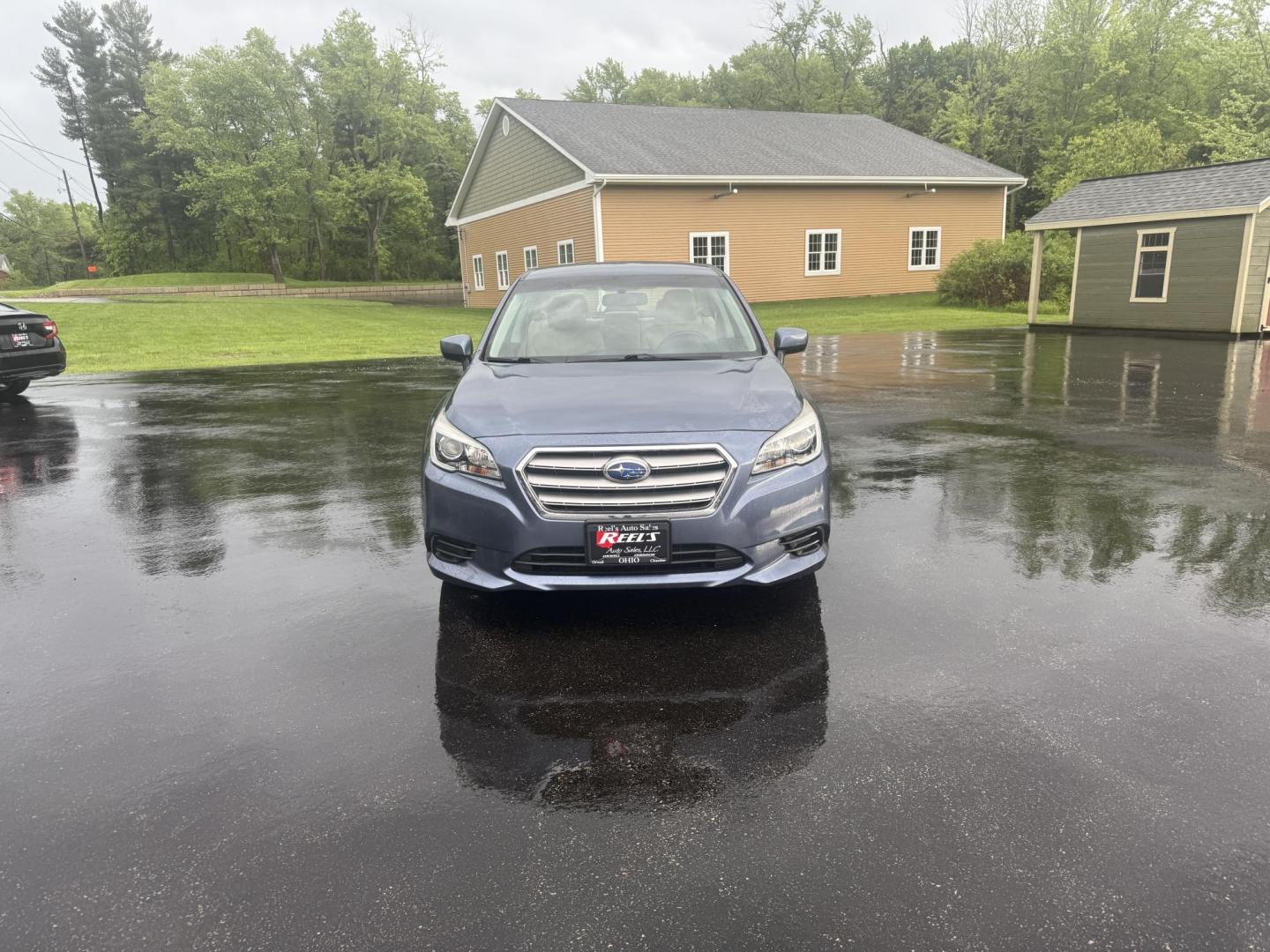 2015 Blue /Tan Subaru Legacy 2.5i Premium (4S3BNAC69F3) with an 2.5L H4 DOHC 16V engine, Automatic transmission, located at 11115 Chardon Rd. , Chardon, OH, 44024, (440) 214-9705, 41.580246, -81.241943 - This 2015 Subaru Legacy 2.5i Premium is equipped with a 2.5L H4 engine and Subaru's renowned Symmetrical All-Wheel Drive, delivering excellent traction and up to 35 MPG highway. This midsize sedan offers comfort and convenience with dual-zone automatic climate control, heated front seats, a power dr - Photo#1