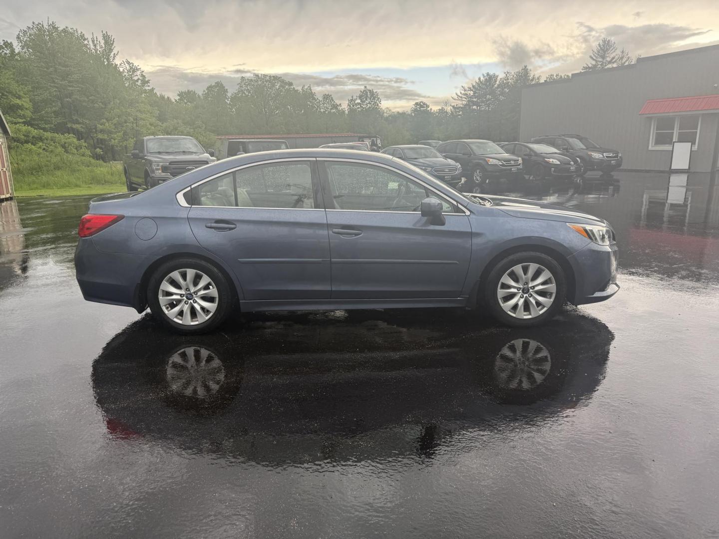 2015 Blue /Tan Subaru Legacy 2.5i Premium (4S3BNAC69F3) with an 2.5L H4 DOHC 16V engine, Automatic transmission, located at 11115 Chardon Rd. , Chardon, OH, 44024, (440) 214-9705, 41.580246, -81.241943 - This 2015 Subaru Legacy 2.5i Premium is equipped with a 2.5L H4 engine and Subaru's renowned Symmetrical All-Wheel Drive, delivering excellent traction and up to 35 MPG highway. This midsize sedan offers comfort and convenience with dual-zone automatic climate control, heated front seats, a power dr - Photo#5