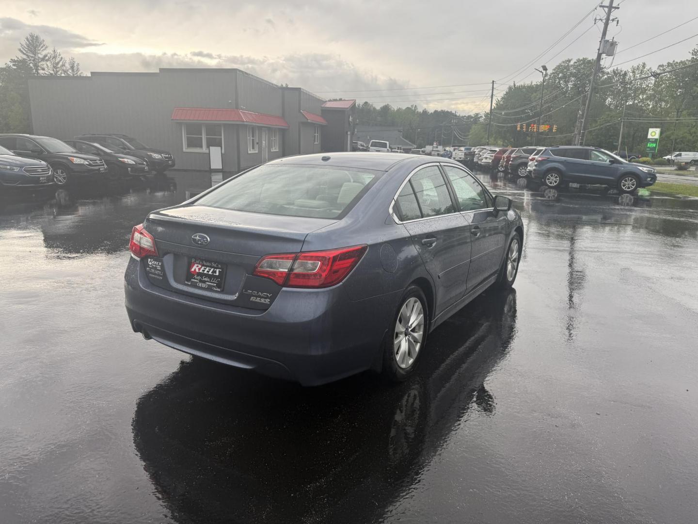 2015 Blue /Tan Subaru Legacy 2.5i Premium (4S3BNAC69F3) with an 2.5L H4 DOHC 16V engine, Automatic transmission, located at 11115 Chardon Rd. , Chardon, OH, 44024, (440) 214-9705, 41.580246, -81.241943 - This 2015 Subaru Legacy 2.5i Premium is equipped with a 2.5L H4 engine and Subaru's renowned Symmetrical All-Wheel Drive, delivering excellent traction and up to 35 MPG highway. This midsize sedan offers comfort and convenience with dual-zone automatic climate control, heated front seats, a power dr - Photo#7