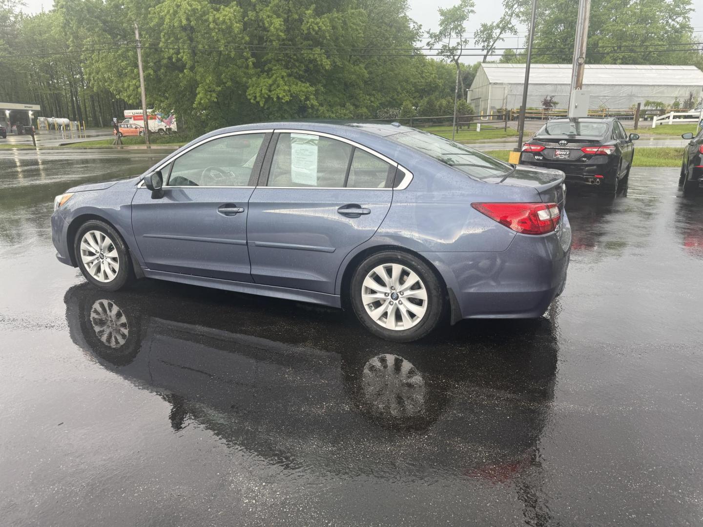2015 Blue /Tan Subaru Legacy 2.5i Premium (4S3BNAC69F3) with an 2.5L H4 DOHC 16V engine, Automatic transmission, located at 11115 Chardon Rd. , Chardon, OH, 44024, (440) 214-9705, 41.580246, -81.241943 - This 2015 Subaru Legacy 2.5i Premium is equipped with a 2.5L H4 engine and Subaru's renowned Symmetrical All-Wheel Drive, delivering excellent traction and up to 35 MPG highway. This midsize sedan offers comfort and convenience with dual-zone automatic climate control, heated front seats, a power dr - Photo#10