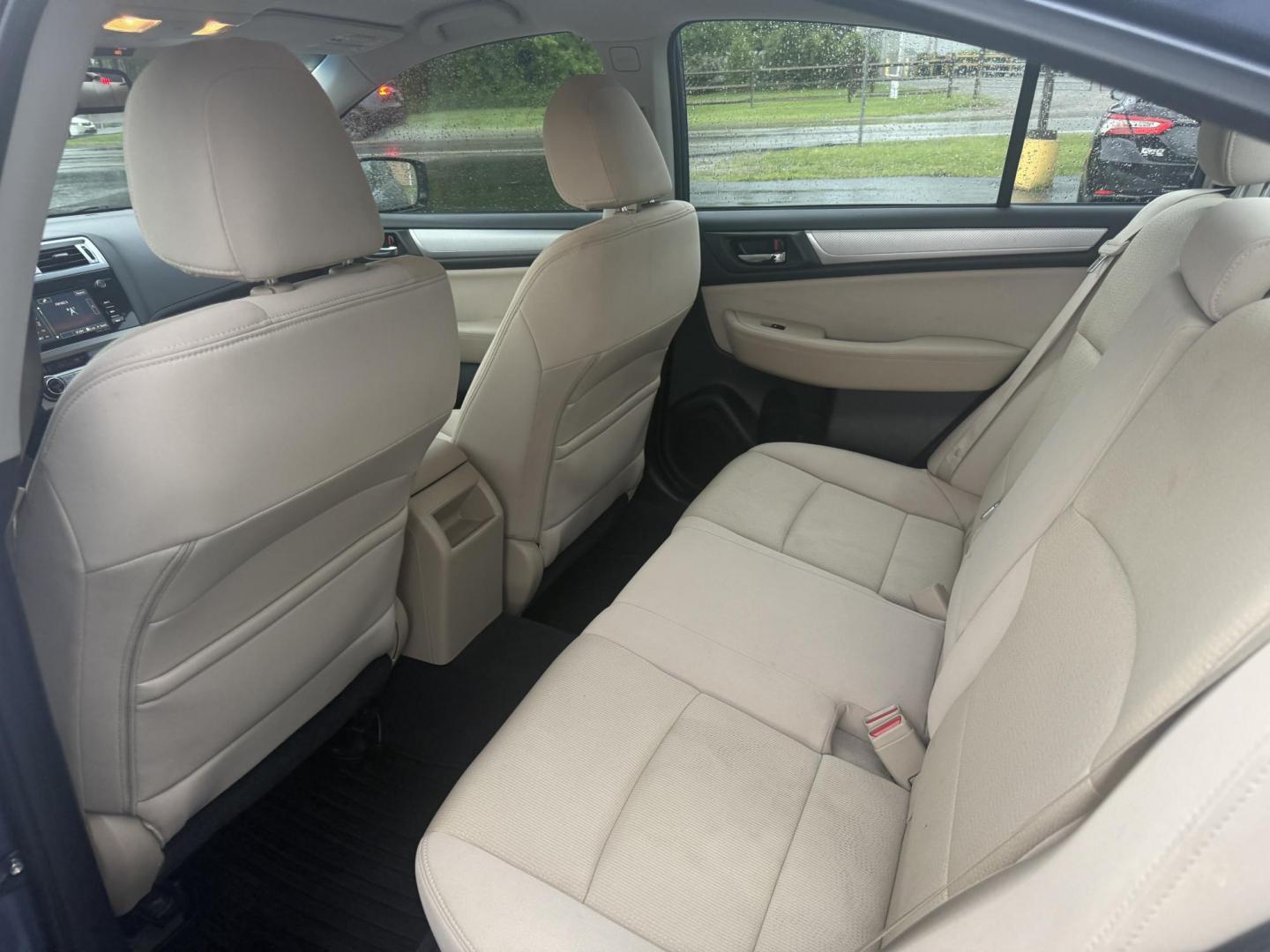 2015 Blue /Tan Subaru Legacy 2.5i Premium (4S3BNAC69F3) with an 2.5L H4 DOHC 16V engine, Automatic transmission, located at 11115 Chardon Rd. , Chardon, OH, 44024, (440) 214-9705, 41.580246, -81.241943 - This 2015 Subaru Legacy 2.5i Premium is equipped with a 2.5L H4 engine and Subaru's renowned Symmetrical All-Wheel Drive, delivering excellent traction and up to 35 MPG highway. This midsize sedan offers comfort and convenience with dual-zone automatic climate control, heated front seats, a power dr - Photo#28
