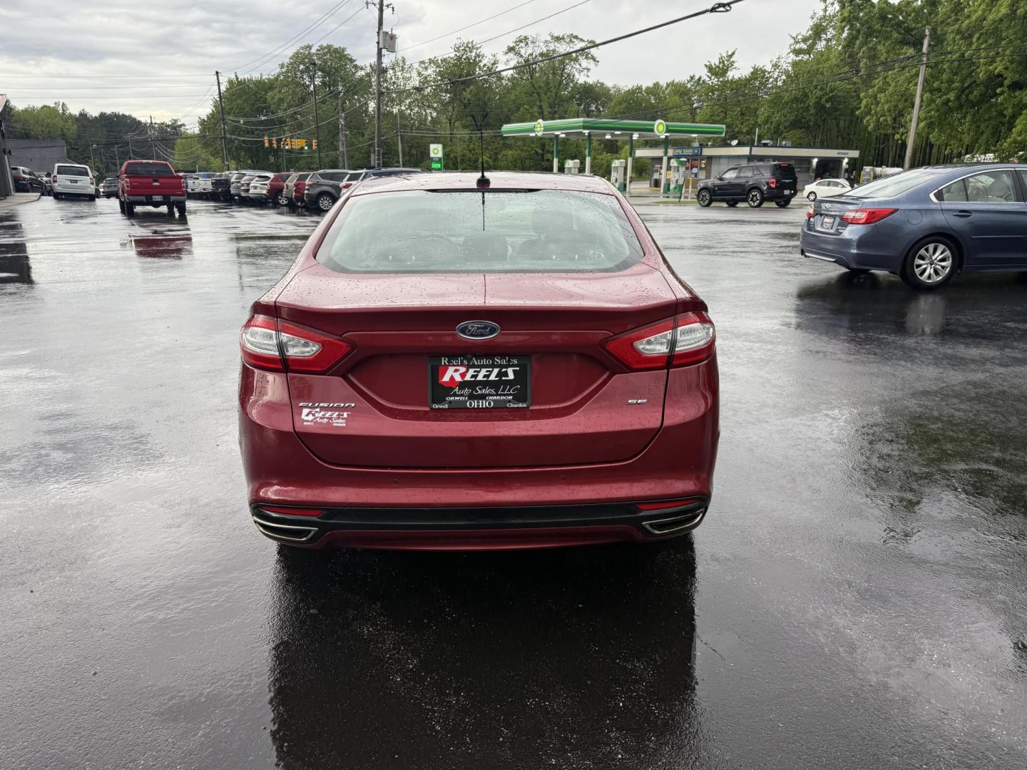 2016 Red /Black Ford Fusion SE AWD (3FA6P0T9XGR) with an 2.0L I4 DOHC 16V Turbo engine, 6A transmission, located at 11115 Chardon Rd. , Chardon, OH, 44024, (440) 214-9705, 41.580246, -81.241943 - This One Owner 2016 Ford Fusion SE AWD features a 2.0L turbocharged I4 engine paired with a 6-speed automatic transmission, offering a quick and fuel-efficient drive with up to 31 MPG highway. It boasts leather interior, heated power driver's seat, dual-zone automatic climate control, power moonroof - Photo#8