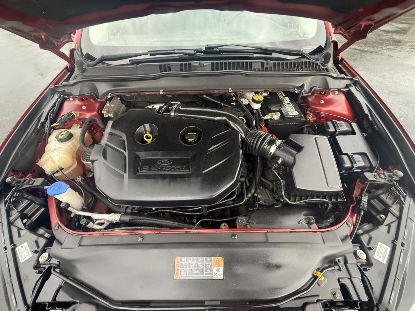 2016 Red /Black Ford Fusion SE AWD (3FA6P0T9XGR) with an 2.0L I4 DOHC 16V Turbo engine, 6A transmission, located at 11115 Chardon Rd. , Chardon, OH, 44024, (440) 214-9705, 41.580246, -81.241943 - This One Owner 2016 Ford Fusion SE AWD features a 2.0L turbocharged I4 engine paired with a 6-speed automatic transmission, offering a quick and fuel-efficient drive with up to 31 MPG highway. It boasts leather interior, heated power driver's seat, dual-zone automatic climate control, power moonroof - Photo#14