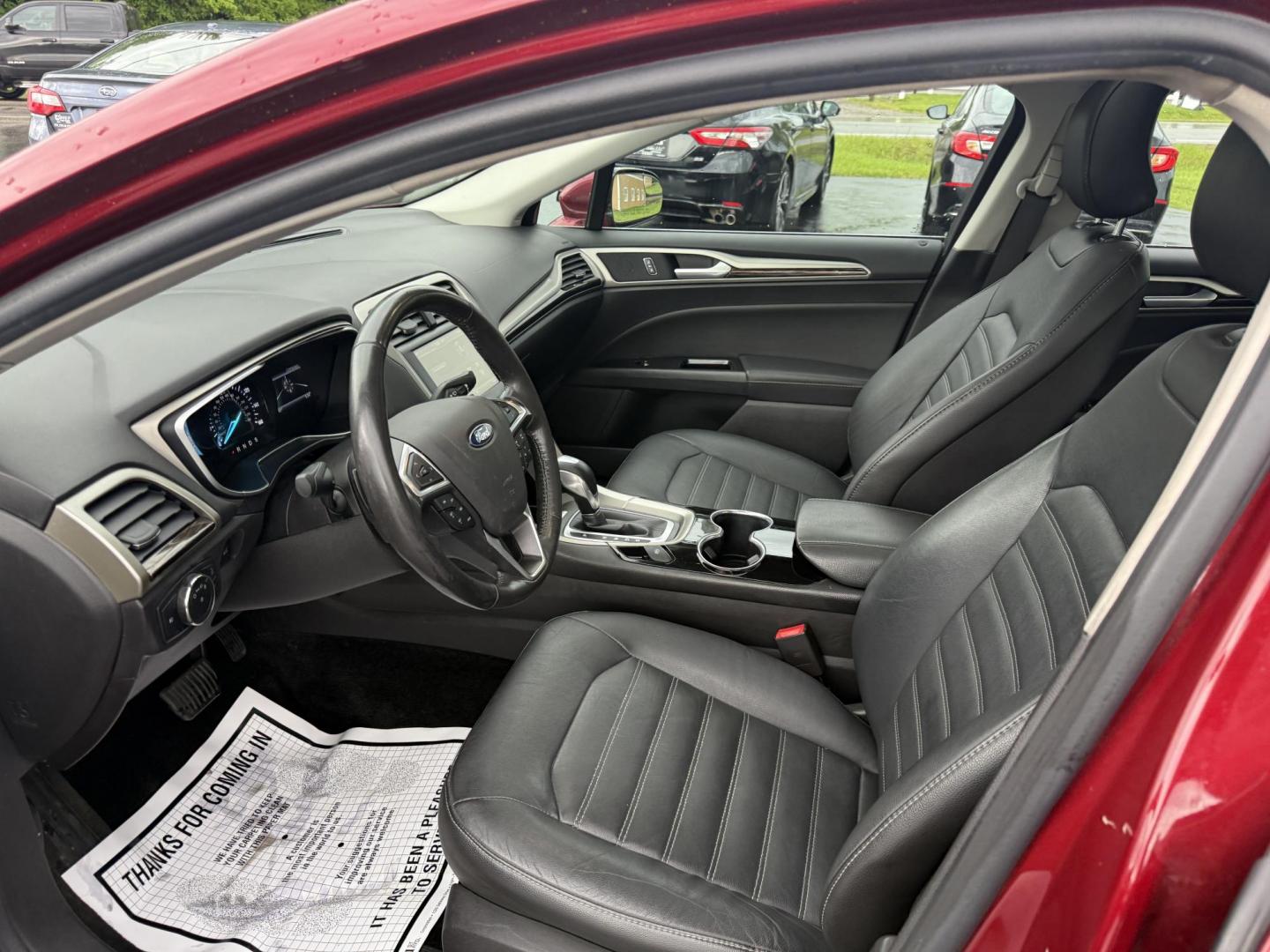 2016 Red /Black Ford Fusion SE AWD (3FA6P0T9XGR) with an 2.0L I4 DOHC 16V Turbo engine, 6A transmission, located at 11115 Chardon Rd. , Chardon, OH, 44024, (440) 214-9705, 41.580246, -81.241943 - This One Owner 2016 Ford Fusion SE AWD features a 2.0L turbocharged I4 engine paired with a 6-speed automatic transmission, offering a quick and fuel-efficient drive with up to 31 MPG highway. It boasts leather interior, heated power driver's seat, dual-zone automatic climate control, power moonroof - Photo#15