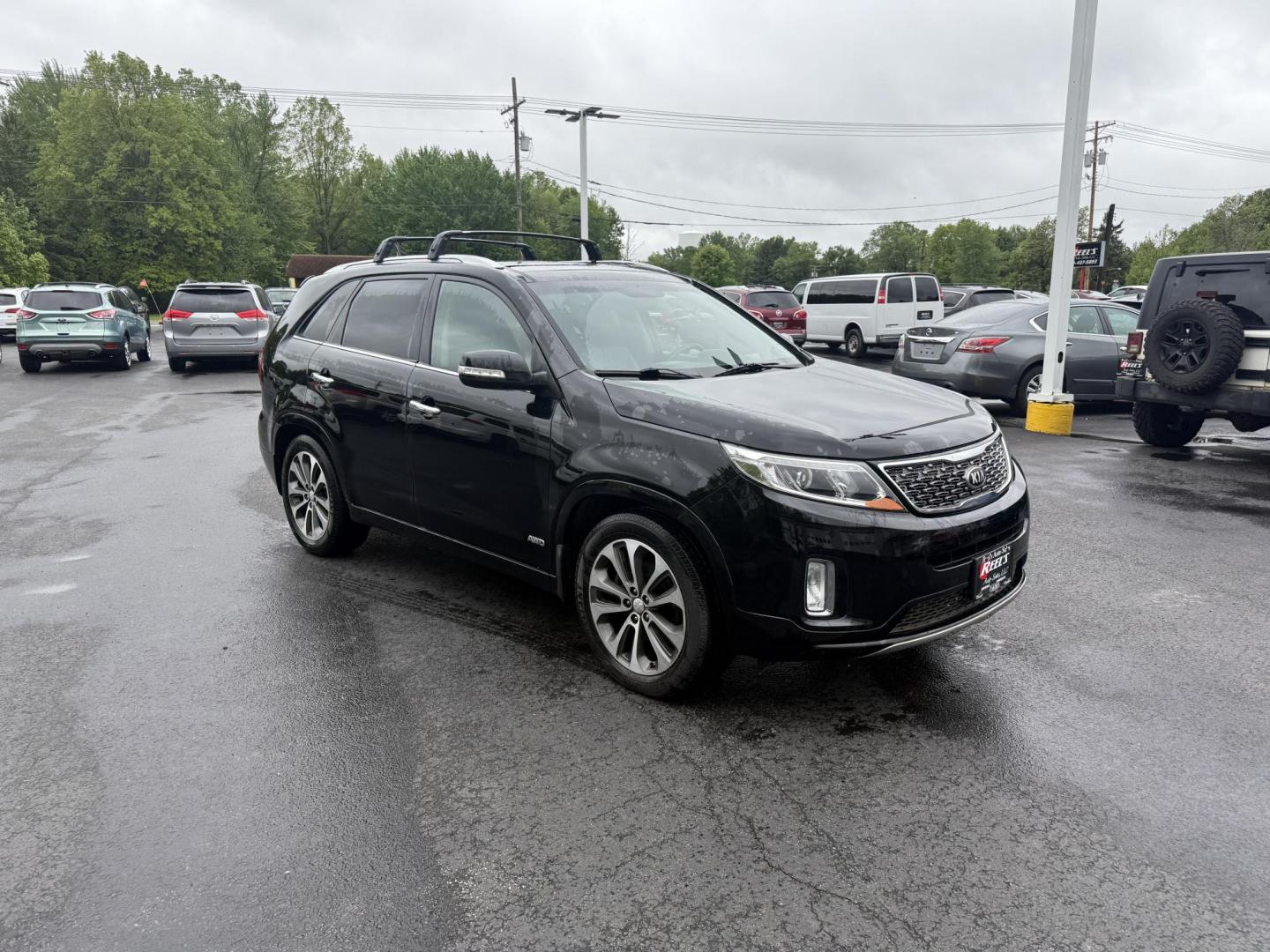 2014 Black /Black Kia Sorento SX V6 AWD (5XYKWDA78EG) with an 3.3L V6 DOHC 24V engine, 6-Speed Automatic transmission, located at 547 E. Main St., Orwell, OH, 44076, (440) 437-5893, 41.535435, -80.847855 - This 2014 Kia Sorento is a fully loaded family hauler. Equipped with Kia's 3.3 GDI V6 and a tried and true 6 speed automatic transmission it can haul 7 people and tow up to 3,500 pounds. On the inside you will find a luxurious leather interior, heated and cooled front seats, a 10 speaker Infinity su - Photo#2