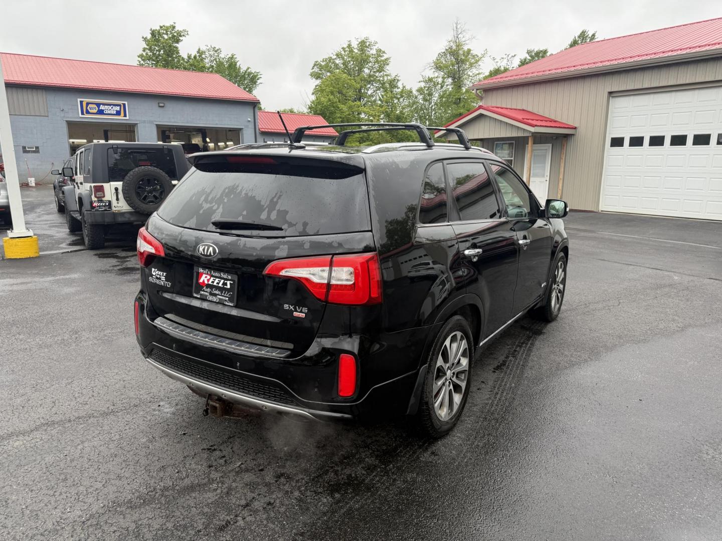 2014 Black /Black Kia Sorento SX V6 AWD (5XYKWDA78EG) with an 3.3L V6 DOHC 24V engine, 6-Speed Automatic transmission, located at 547 E. Main St., Orwell, OH, 44076, (440) 437-5893, 41.535435, -80.847855 - This 2014 Kia Sorento is a fully loaded family hauler. Equipped with Kia's 3.3 GDI V6 and a tried and true 6 speed automatic transmission it can haul 7 people and tow up to 3,500 pounds. On the inside you will find a luxurious leather interior, heated and cooled front seats, a 10 speaker Infinity su - Photo#8