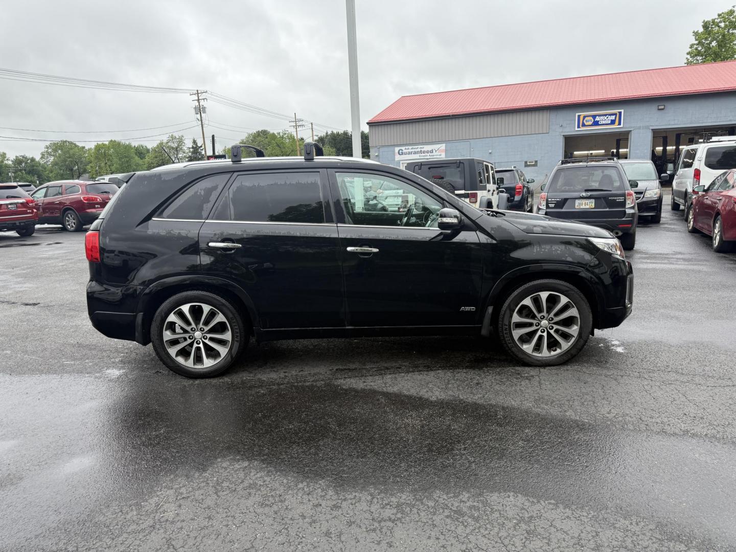 2014 Black /Black Kia Sorento SX V6 AWD (5XYKWDA78EG) with an 3.3L V6 DOHC 24V engine, 6-Speed Automatic transmission, located at 547 E. Main St., Orwell, OH, 44076, (440) 437-5893, 41.535435, -80.847855 - This 2014 Kia Sorento is a fully loaded family hauler. Equipped with Kia's 3.3 GDI V6 and a tried and true 6 speed automatic transmission it can haul 7 people and tow up to 3,500 pounds. On the inside you will find a luxurious leather interior, heated and cooled front seats, a 10 speaker Infinity su - Photo#6