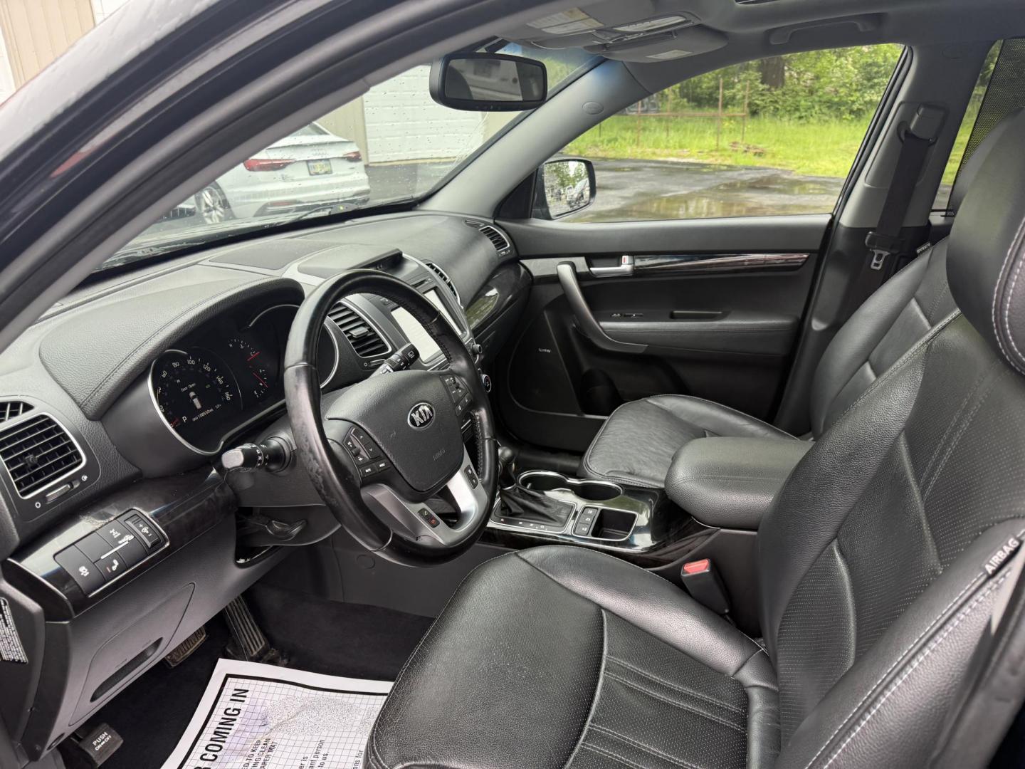 2014 Black /Black Kia Sorento SX V6 AWD (5XYKWDA78EG) with an 3.3L V6 DOHC 24V engine, 6-Speed Automatic transmission, located at 547 E. Main St., Orwell, OH, 44076, (440) 437-5893, 41.535435, -80.847855 - This 2014 Kia Sorento is a fully loaded family hauler. Equipped with Kia's 3.3 GDI V6 and a tried and true 6 speed automatic transmission it can haul 7 people and tow up to 3,500 pounds. On the inside you will find a luxurious leather interior, heated and cooled front seats, a 10 speaker Infinity su - Photo#15