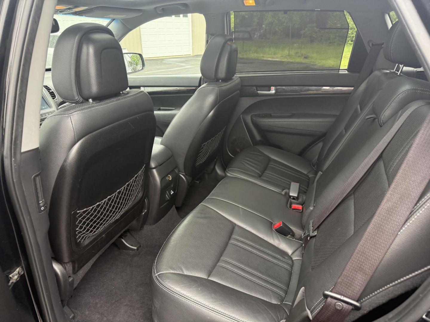 2014 Black /Black Kia Sorento SX V6 AWD (5XYKWDA78EG) with an 3.3L V6 DOHC 24V engine, 6-Speed Automatic transmission, located at 547 E. Main St., Orwell, OH, 44076, (440) 437-5893, 41.535435, -80.847855 - This 2014 Kia Sorento is a fully loaded family hauler. Equipped with Kia's 3.3 GDI V6 and a tried and true 6 speed automatic transmission it can haul 7 people and tow up to 3,500 pounds. On the inside you will find a luxurious leather interior, heated and cooled front seats, a 10 speaker Infinity su - Photo#34