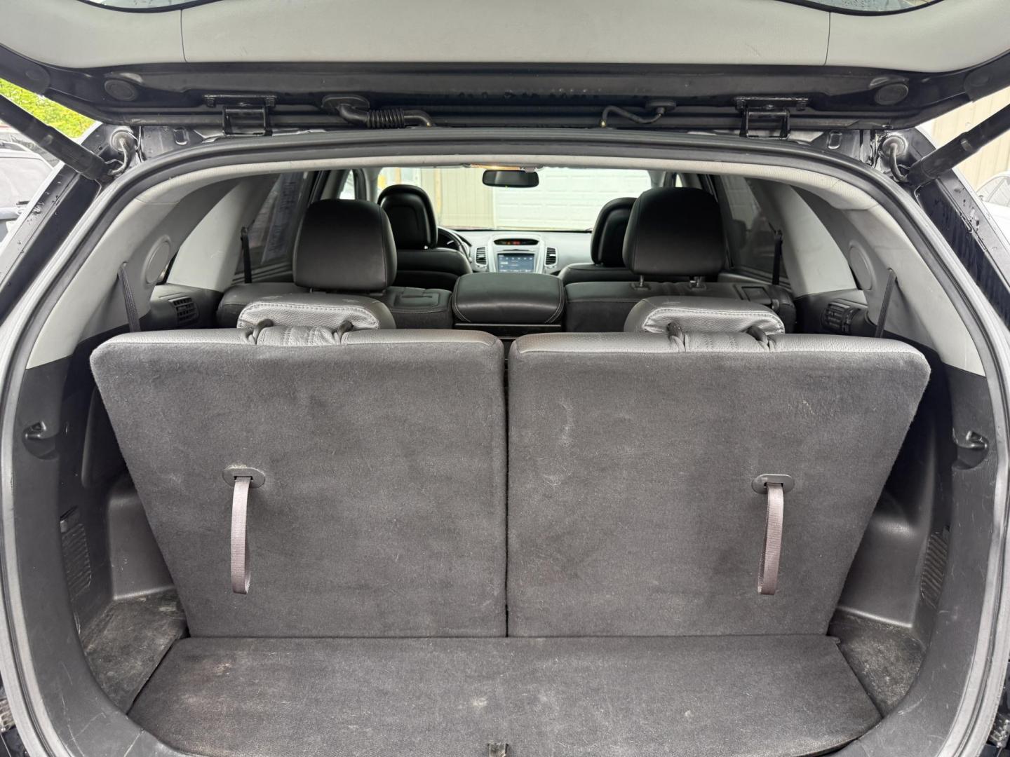 2014 Black /Black Kia Sorento SX V6 AWD (5XYKWDA78EG) with an 3.3L V6 DOHC 24V engine, 6-Speed Automatic transmission, located at 547 E. Main St., Orwell, OH, 44076, (440) 437-5893, 41.535435, -80.847855 - This 2014 Kia Sorento is a fully loaded family hauler. Equipped with Kia's 3.3 GDI V6 and a tried and true 6 speed automatic transmission it can haul 7 people and tow up to 3,500 pounds. On the inside you will find a luxurious leather interior, heated and cooled front seats, a 10 speaker Infinity su - Photo#40