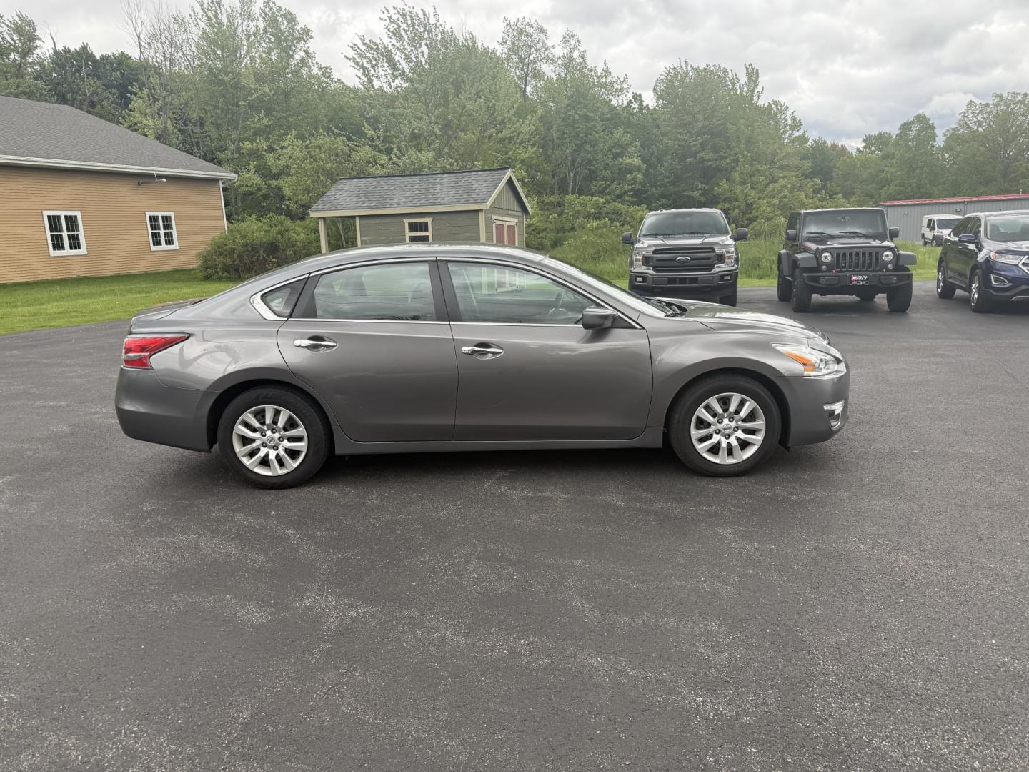 2015 Gray /Black Nissan Altima 2.5 S (1N4AL3AP0FC) with an 2.5L I4 DOHC 16V engine, Automatic transmission, located at 11115 Chardon Rd. , Chardon, OH, 44024, (440) 214-9705, 41.580246, -81.241943 - This One Owner 2015 Nissan Altima is an incredibly fuel efficient commuter sedan. Powered by a 2.5 I4 engine it gets 31 MPG combined and up to 37 MPG highway. On the side you get a power drivers seat, push button start, a sport driving mode, and an aux audio input. This Altima is fully serviced and - Photo#5
