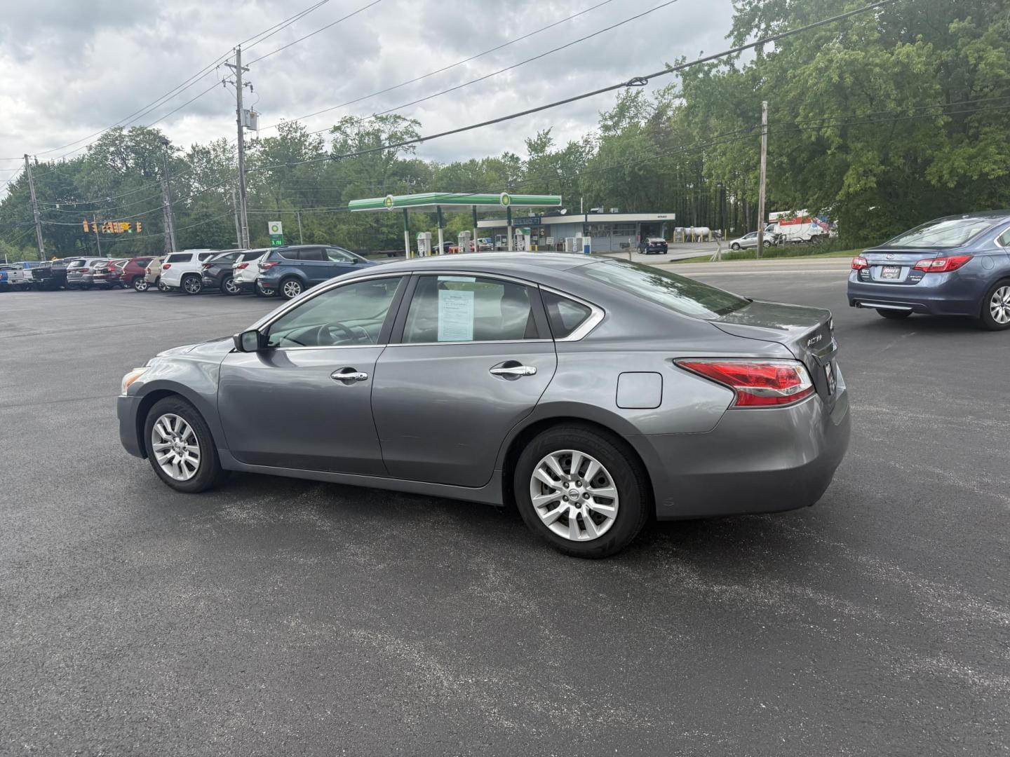 2015 Gray /Black Nissan Altima 2.5 S (1N4AL3AP0FC) with an 2.5L I4 DOHC 16V engine, Automatic transmission, located at 11115 Chardon Rd. , Chardon, OH, 44024, (440) 214-9705, 41.580246, -81.241943 - This One Owner 2015 Nissan Altima is an incredibly fuel efficient commuter sedan. Powered by a 2.5 I4 engine it gets 31 MPG combined and up to 37 MPG highway. On the side you get a power drivers seat, push button start, a sport driving mode, and an aux audio input. This Altima is fully serviced and - Photo#10