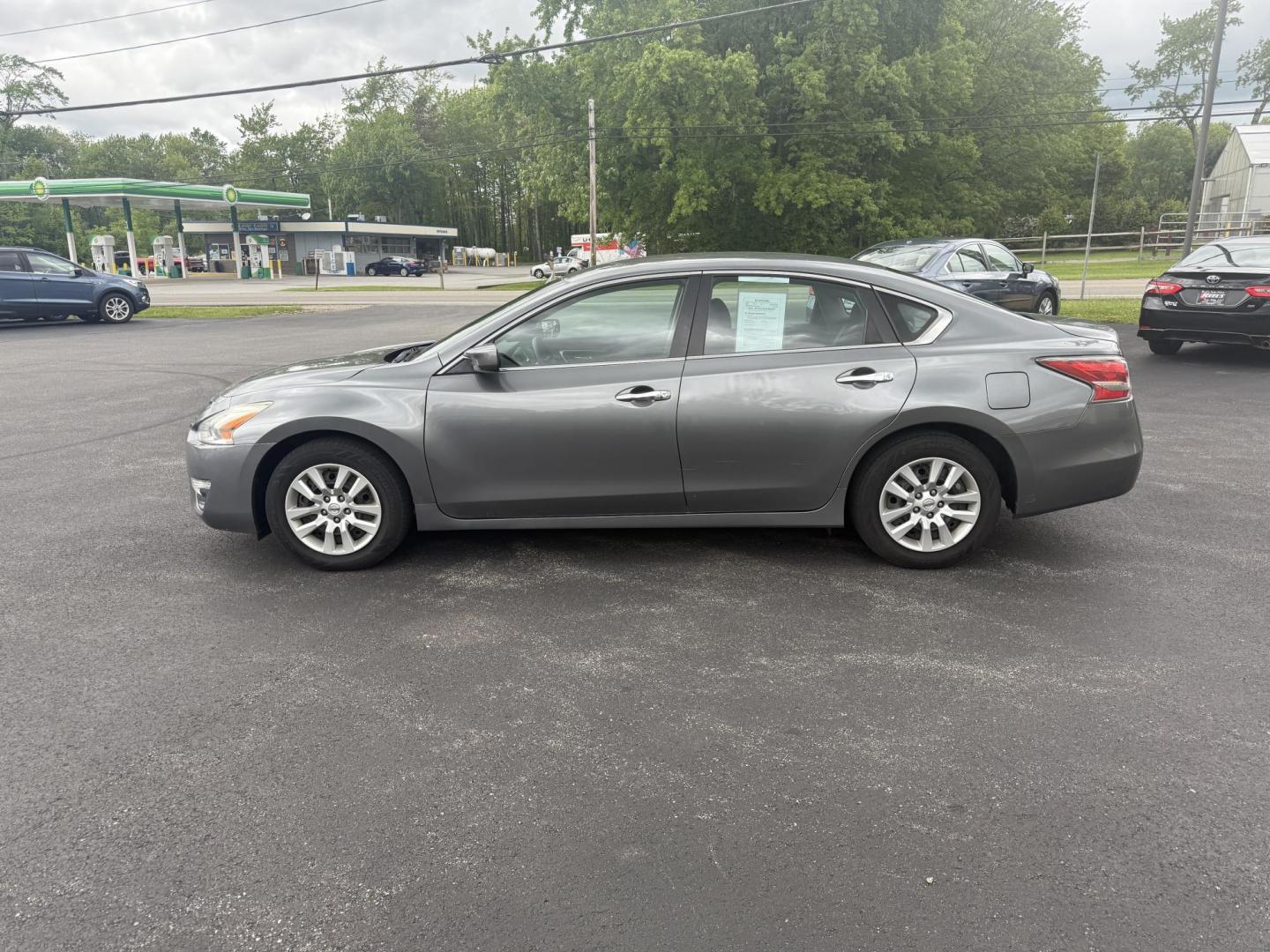2015 Gray /Black Nissan Altima 2.5 S (1N4AL3AP0FC) with an 2.5L I4 DOHC 16V engine, Automatic transmission, located at 11115 Chardon Rd. , Chardon, OH, 44024, (440) 214-9705, 41.580246, -81.241943 - This One Owner 2015 Nissan Altima is an incredibly fuel efficient commuter sedan. Powered by a 2.5 I4 engine it gets 31 MPG combined and up to 37 MPG highway. On the side you get a power drivers seat, push button start, a sport driving mode, and an aux audio input. This Altima is fully serviced and - Photo#12
