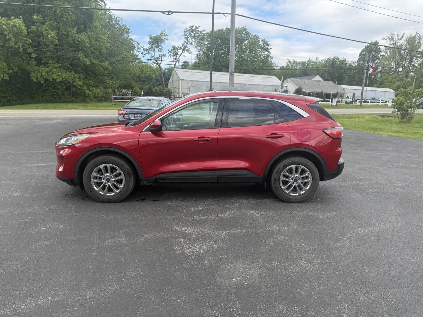 2020 Red /Black Ford Escape SE AWD (1FMCU9G68LU) with an 1.5L I3 DOHC 12V TURBO engine, 8-Speed Automatic transmission, located at 11115 Chardon Rd. , Chardon, OH, 44024, (440) 214-9705, 41.580246, -81.241943 - This 2020 Ford Escape SE is a modern and fuel efficient SUV. Equipped with a 1.5 I3 Turbocharged EcoBoost engine and a 8 speed automatic transmission this Escape achieves a very impressive 28 MPG combined and 31 MPG highway. On the inside it has a power drivers seat, heated front seats and, automati - Photo#12