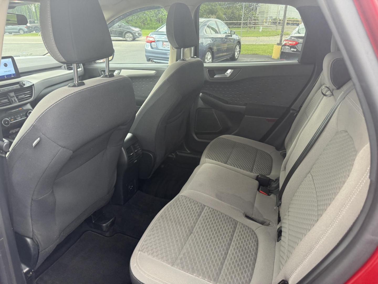 2020 Red /Black Ford Escape SE AWD (1FMCU9G68LU) with an 1.5L I3 DOHC 12V TURBO engine, 8-Speed Automatic transmission, located at 11115 Chardon Rd. , Chardon, OH, 44024, (440) 214-9705, 41.580246, -81.241943 - This 2020 Ford Escape SE is a modern and fuel efficient SUV. Equipped with a 1.5 I3 Turbocharged EcoBoost engine and a 8 speed automatic transmission this Escape achieves a very impressive 28 MPG combined and 31 MPG highway. On the inside it has a power drivers seat, heated front seats and, automati - Photo#27